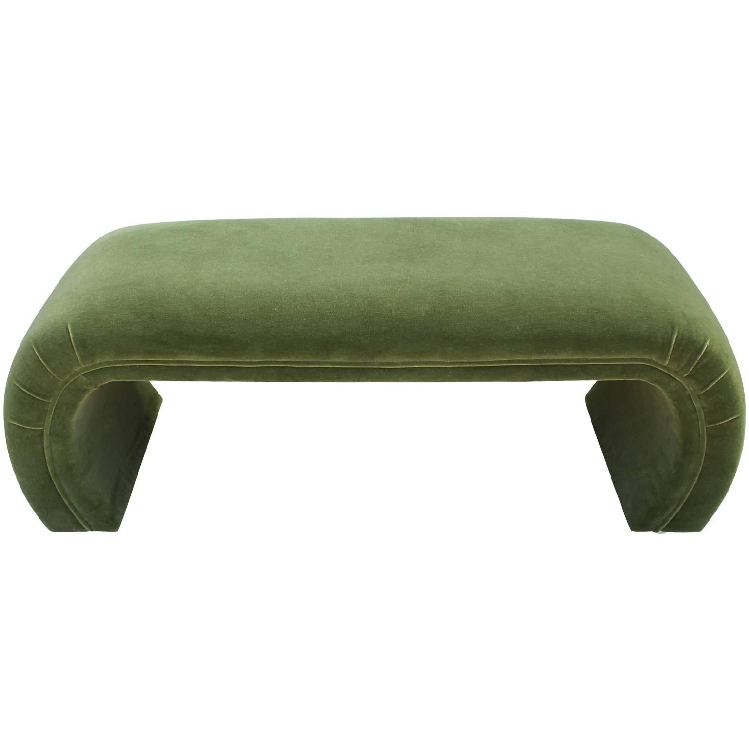 Wonderful scroll shaped bench in the style of Milo Baughman or Karl Springer. Waterfall style bench has elegant curved lines and the perfect amount of detail. Freshly upholstered in a moss green mohair velvet. Perfect at the end of a bed.