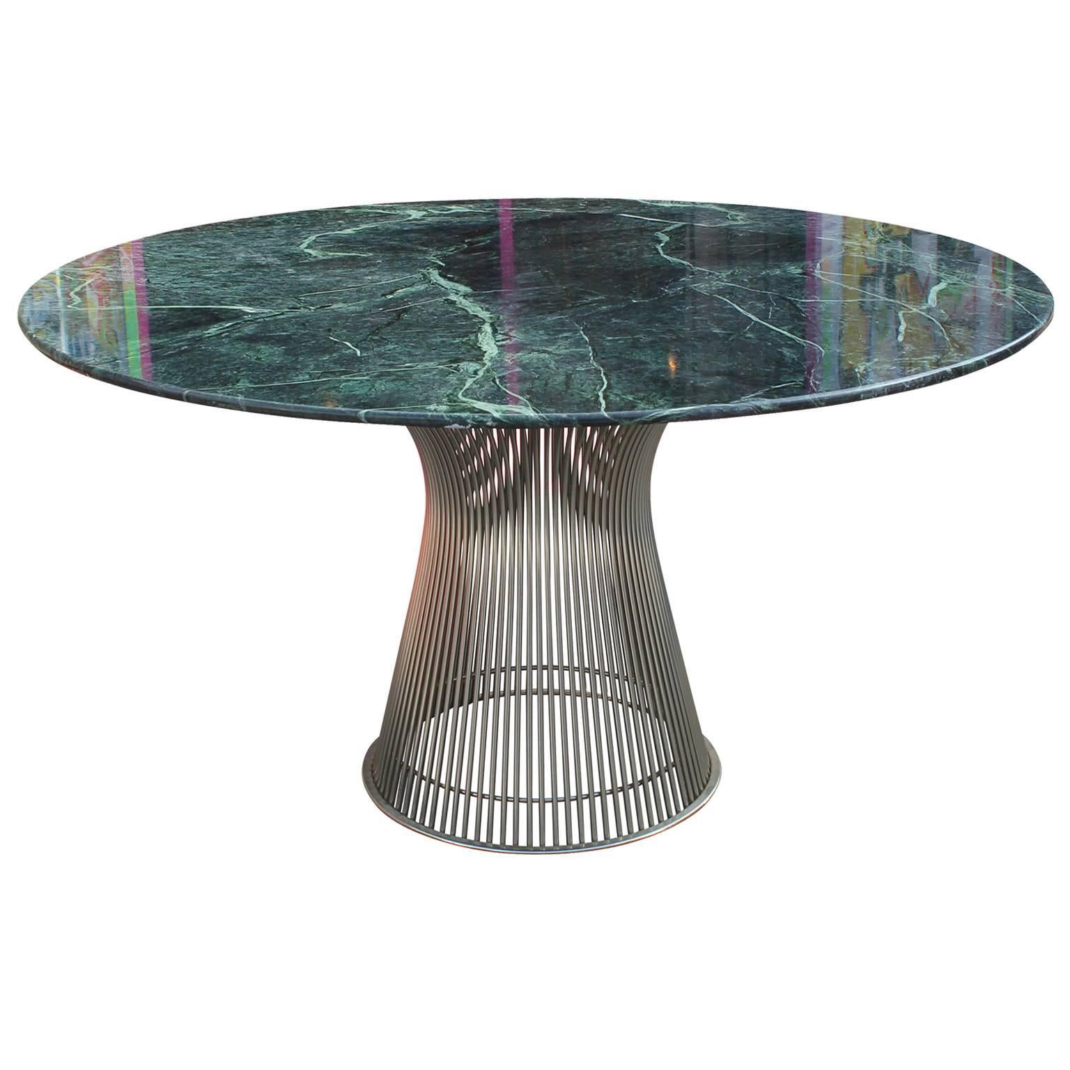 Iconic round dining table by Warren Platner for Knoll. Striking green marble top is supported by a nickel plated wire base. In nice original condition.