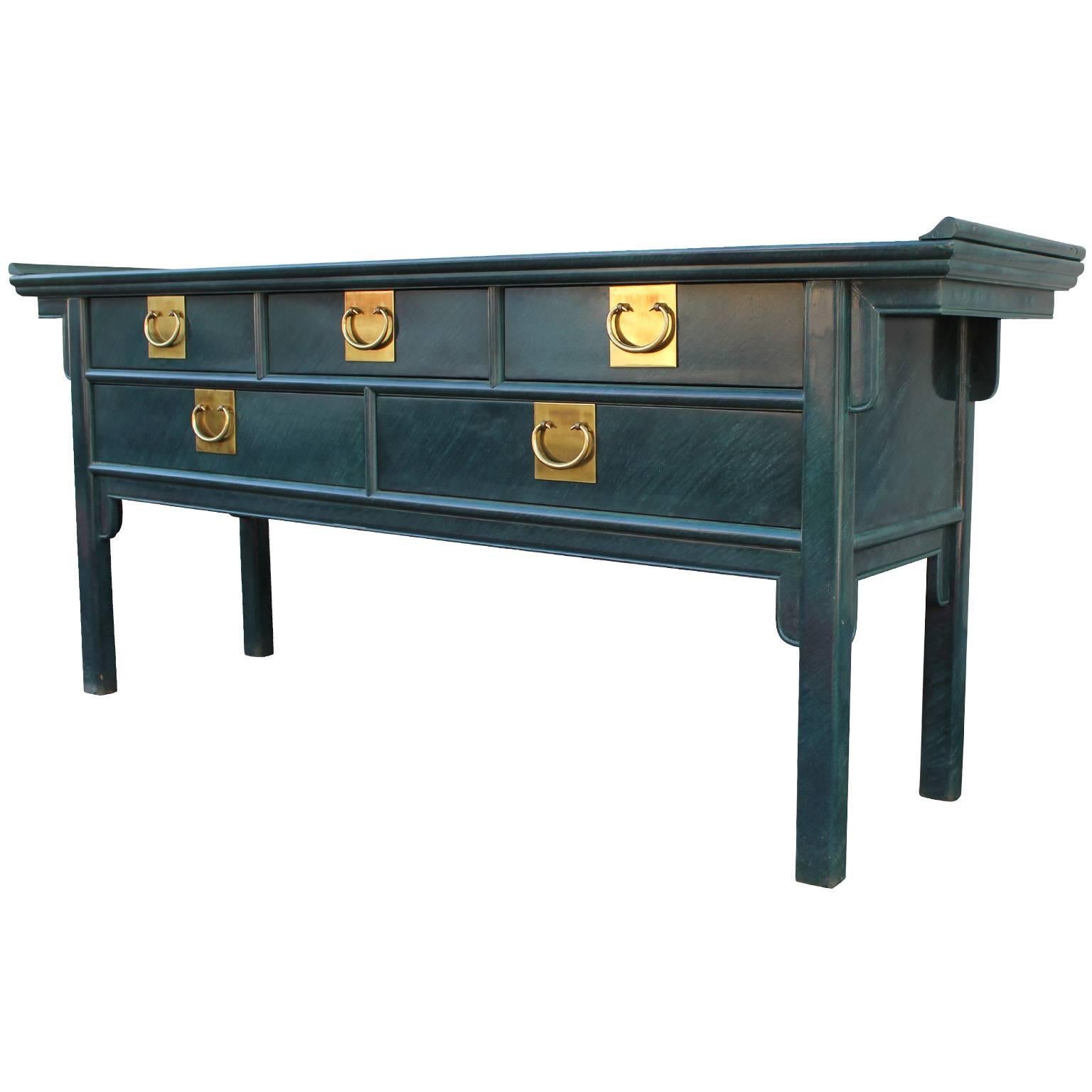 Beautiful lacquered console table made by Century Furniture with Brass Hardware.  It is a deep malachite green faux finish. The console table is in overall nice condition with a few older touch-ups. 