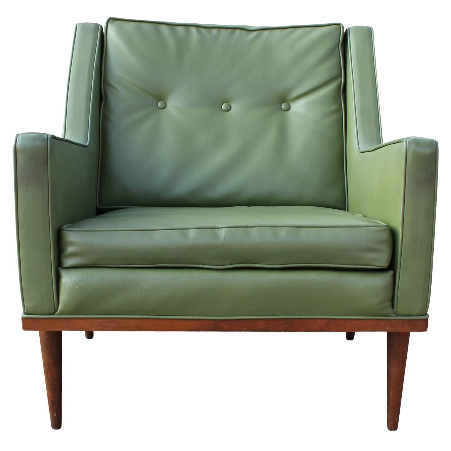 Early pair of Milo Baughman lounge chairs for Thayer Coggin / James Inc Chairs retains both a James Inc. label and Thayer Coggin label. Chairs are in original green vinyl. On chair has a small tear- Updated upholstery is recommended. 