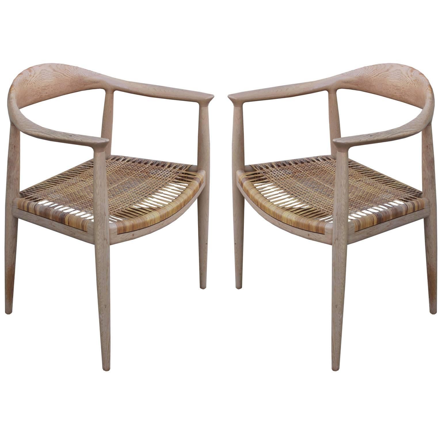 Pair of Early Modern Hans Wegner "The Chair" Chairs Bleached Wood and Woven Cane