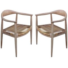 Pair of Early Modern Hans Wegner "The Chair" Chairs Bleached Wood and Woven Cane
