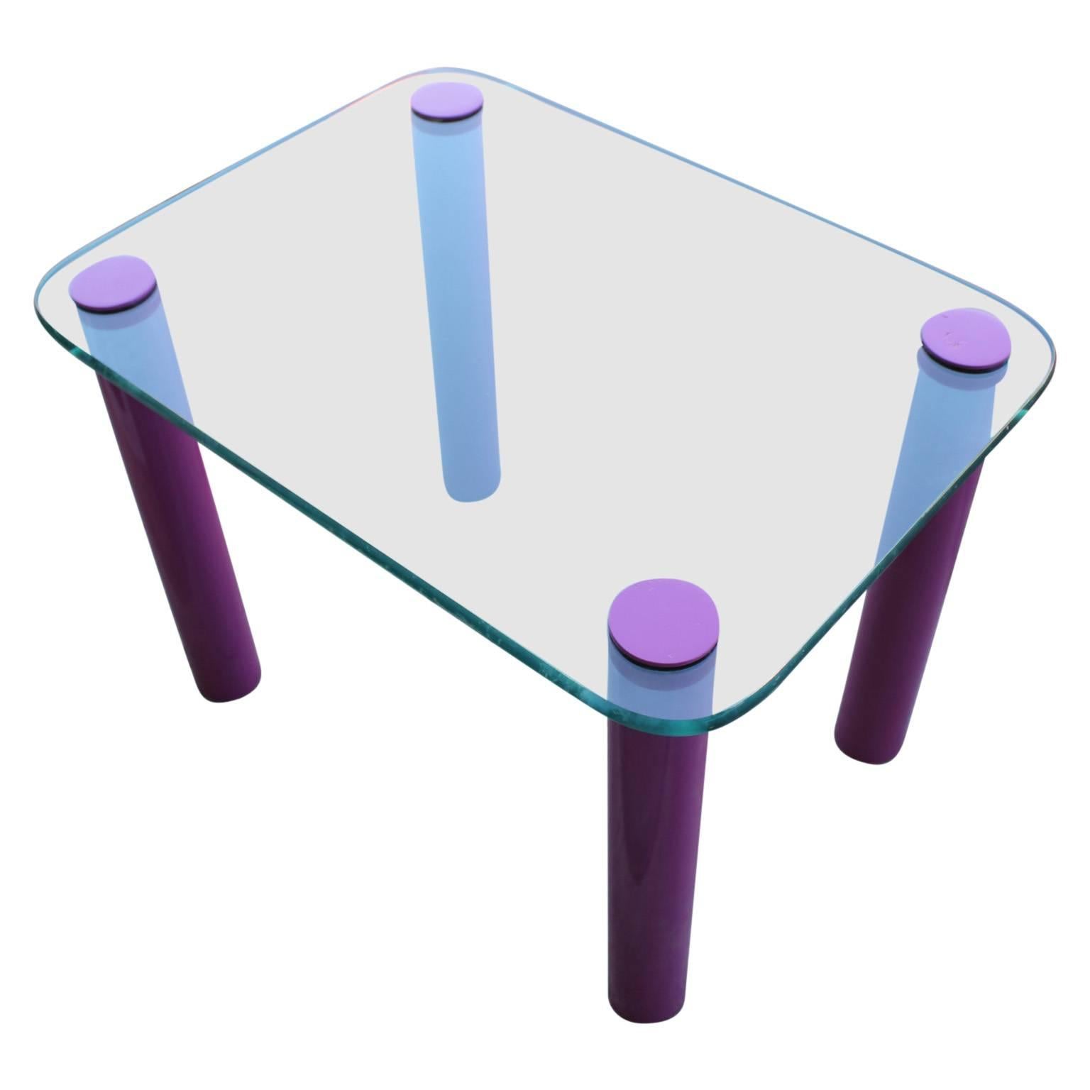Unique rectangular glass side table with purple/pink legs.