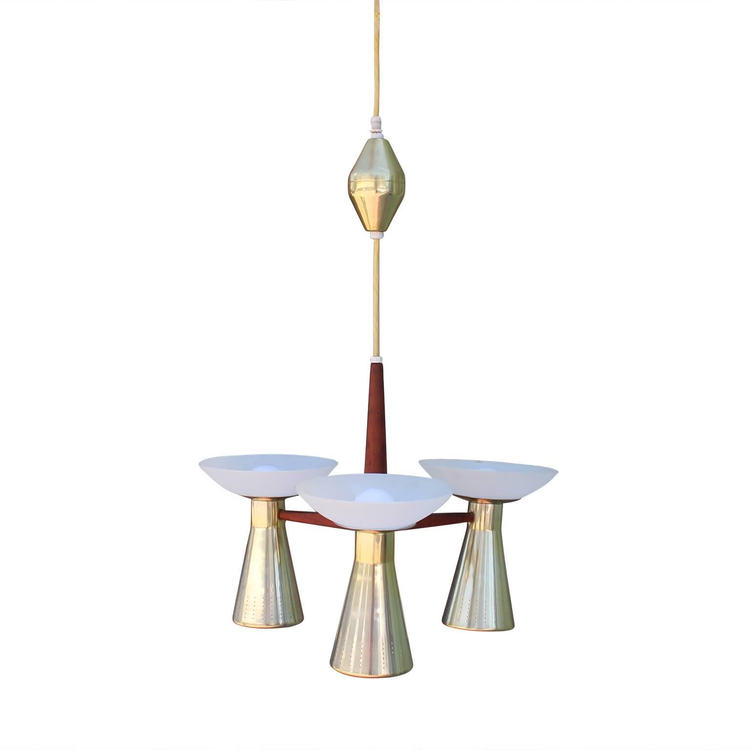 Gorgeous modernist brass and walnut chandelier featuring three double sconces (sockets on both the bottom and top). 

Measurements below are taken from the top of the accent ball, to the very bottom of the brass, and diameter taken from the