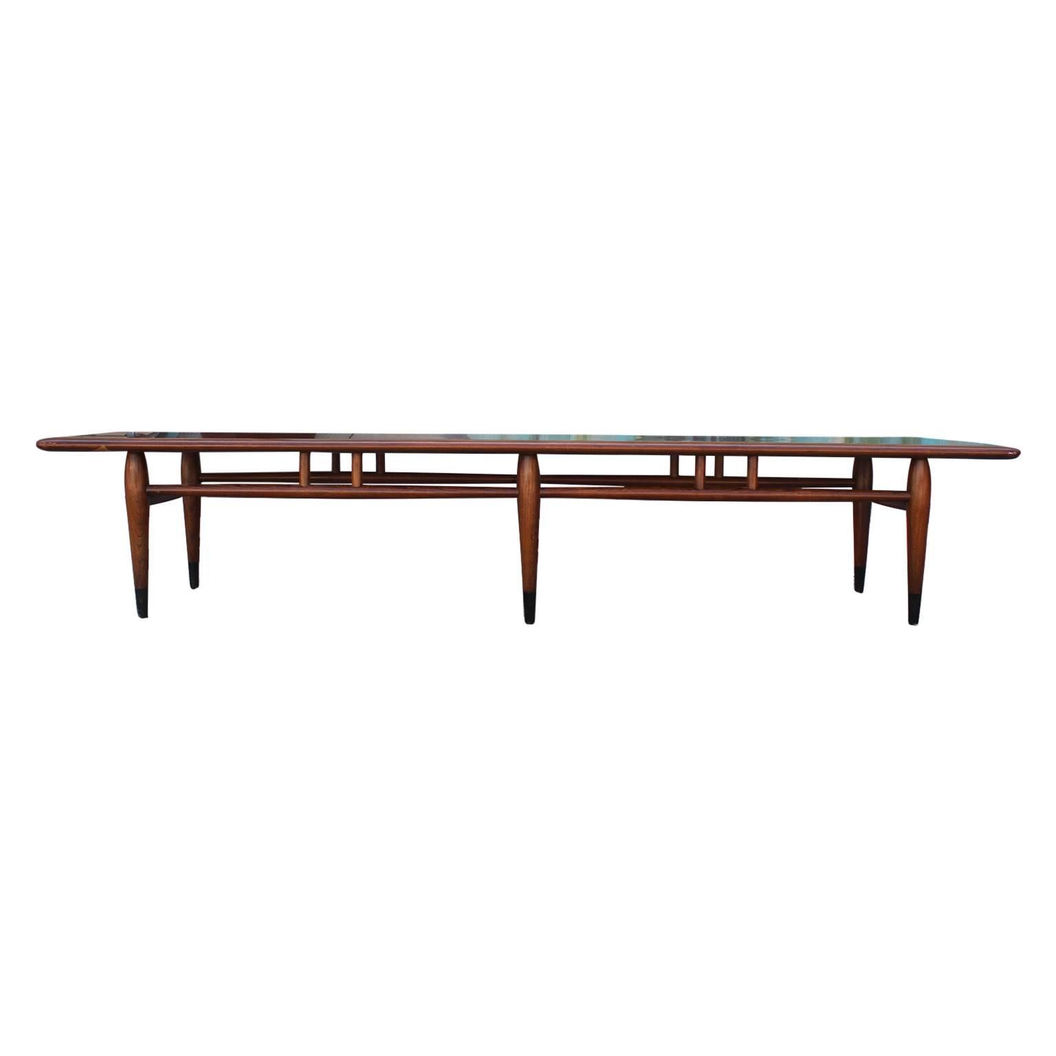 Classic walnut Lane coffee table with two-toned dovetailed detailing. Burn mark shown in pictures.
