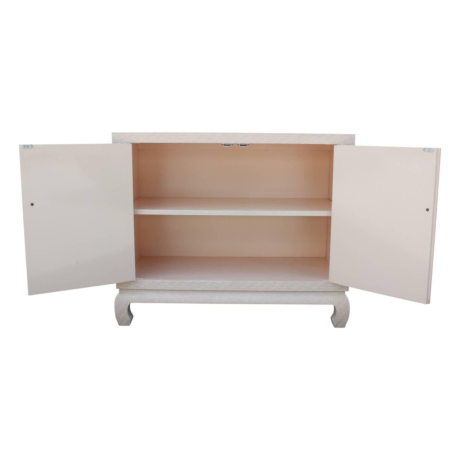 American Modern Baker Cabinet in Cream Lacquered Grass Cloth with Brass Pulls
