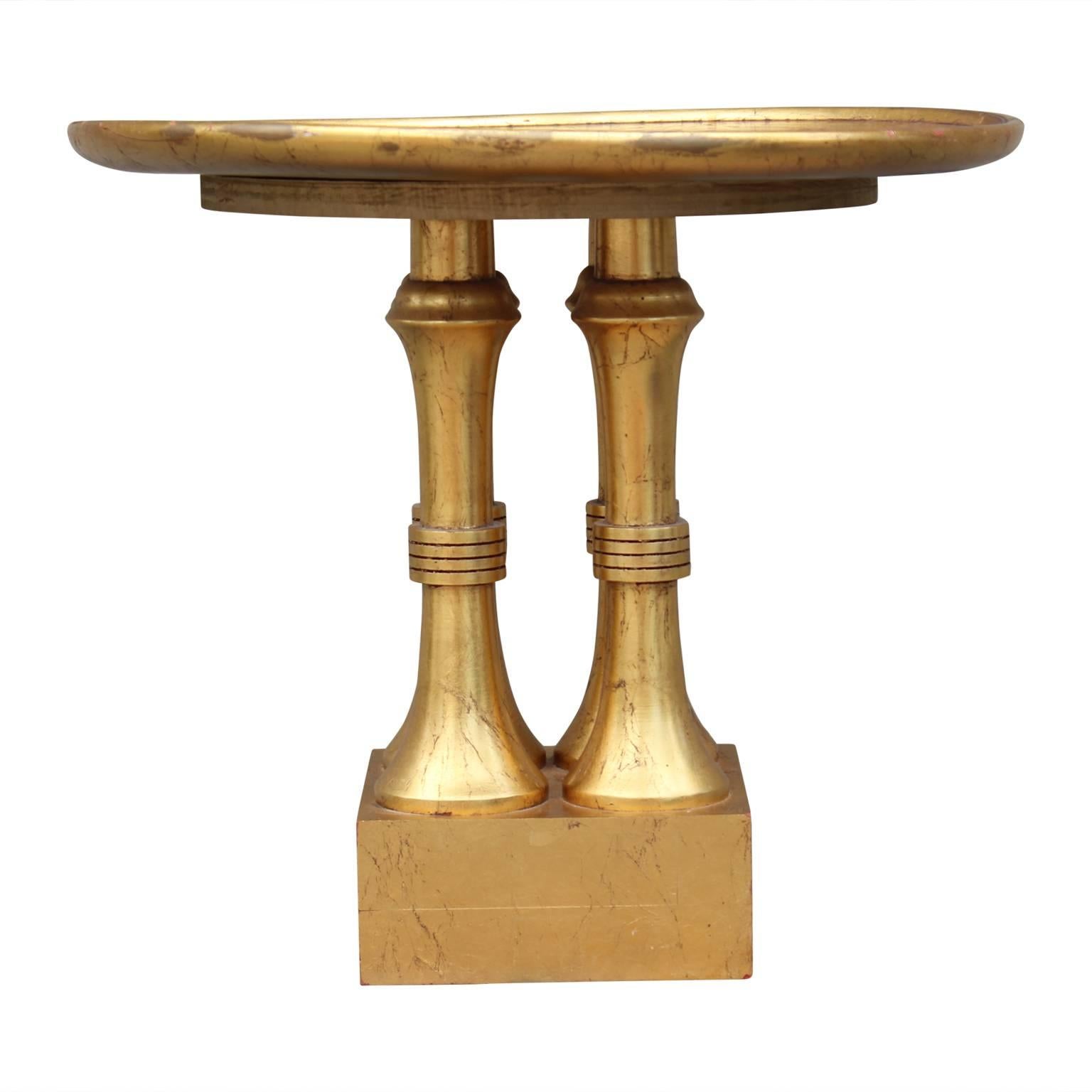 Mid-20th century gold leaf Hollywood Regency side table.