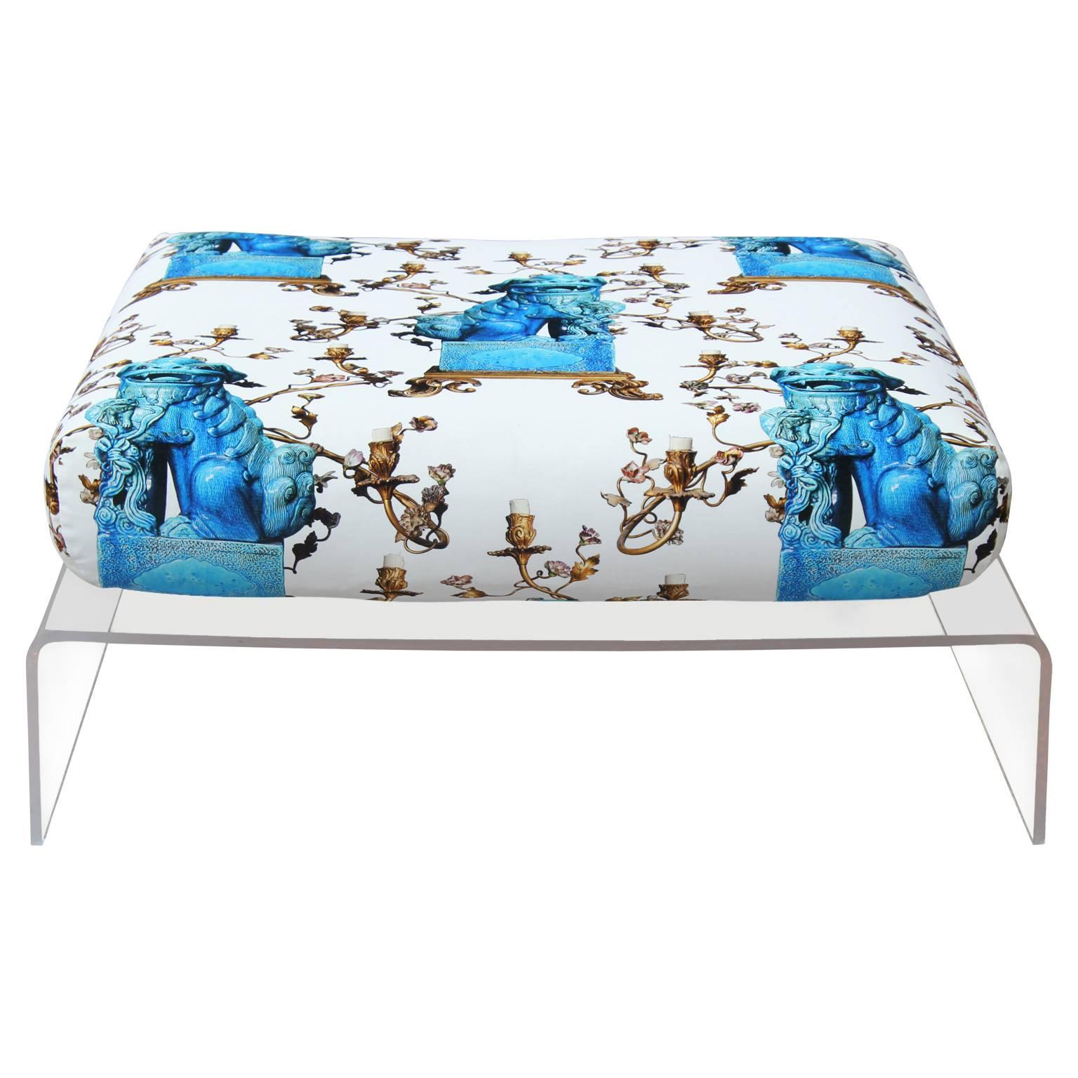 Unique Lucite ottoman or coffee table recently outfitted with a lush turquoise foo dog and swirling candelabra patterned cushion in velvet. In the style of Charles Hollis Jones. To use as a coffee table, place a tray or flat surface down. The