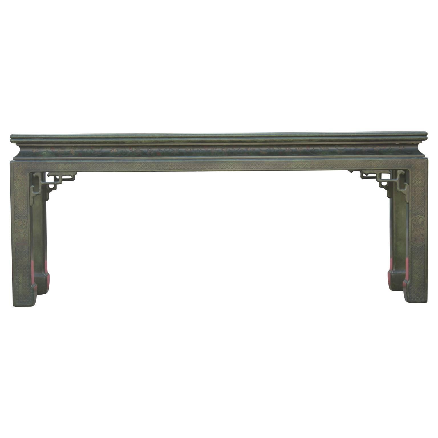 Unique and thoughtfully carved chinoiserie console table in green lacquer in the style of John Widdicomb. A perfect statement piece for any room!