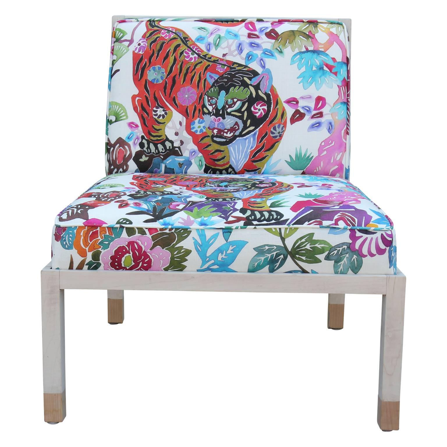Pair of stunning Michael Taylor slipper lounge chairs by Baker Furniture Co. masterfully upholstered in fresh multicolored tiger fabric. Very unique and wonderful statement pieces for any room.  