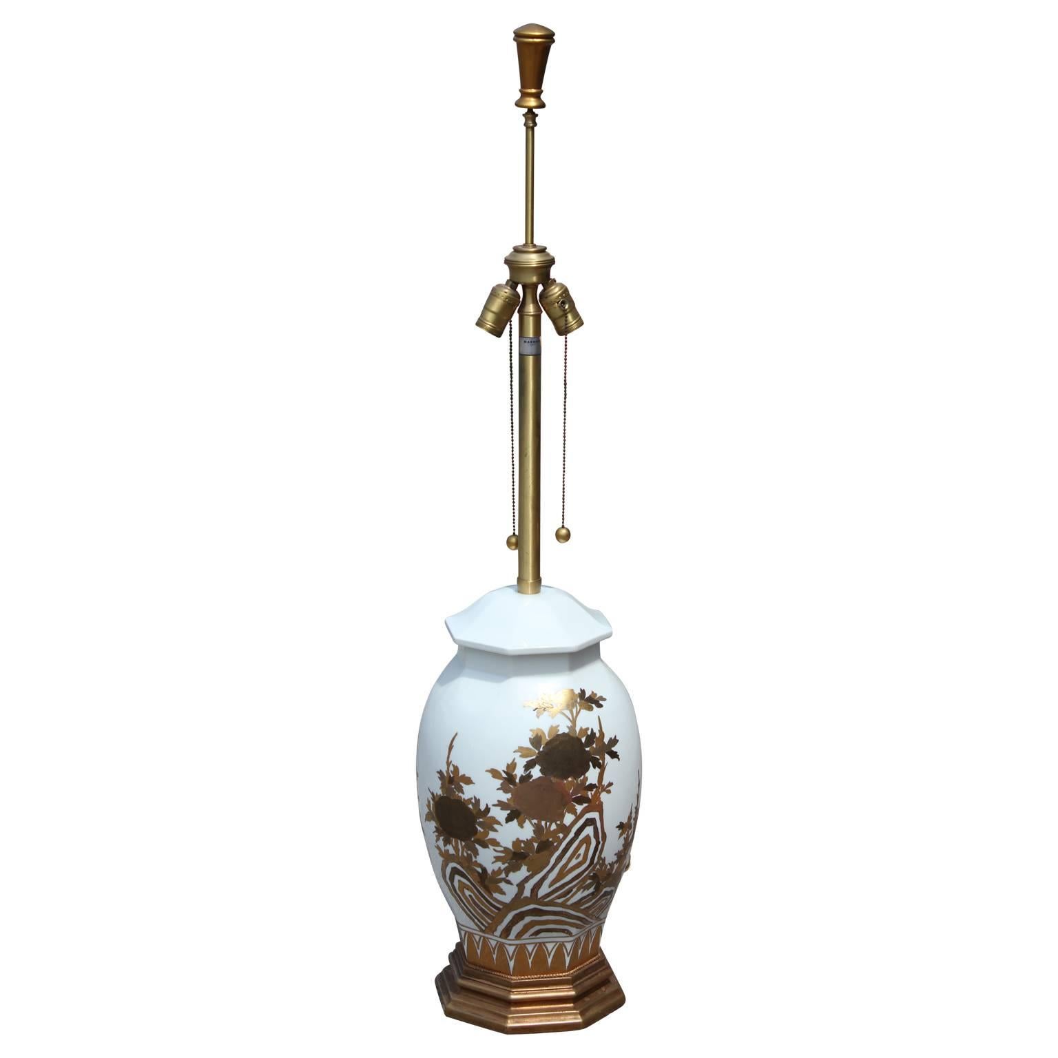 Pair of stunning large white ceramic lamps with gold floral detailing by The Marbro Lamp Company.