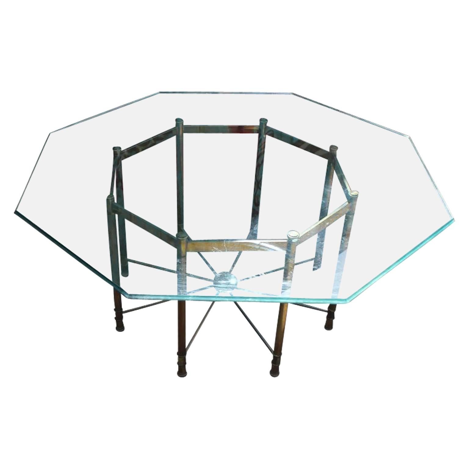 Gorgeous modern Mastercraft brass and glass dining table in the shape of an octagon. Beautiful patina.