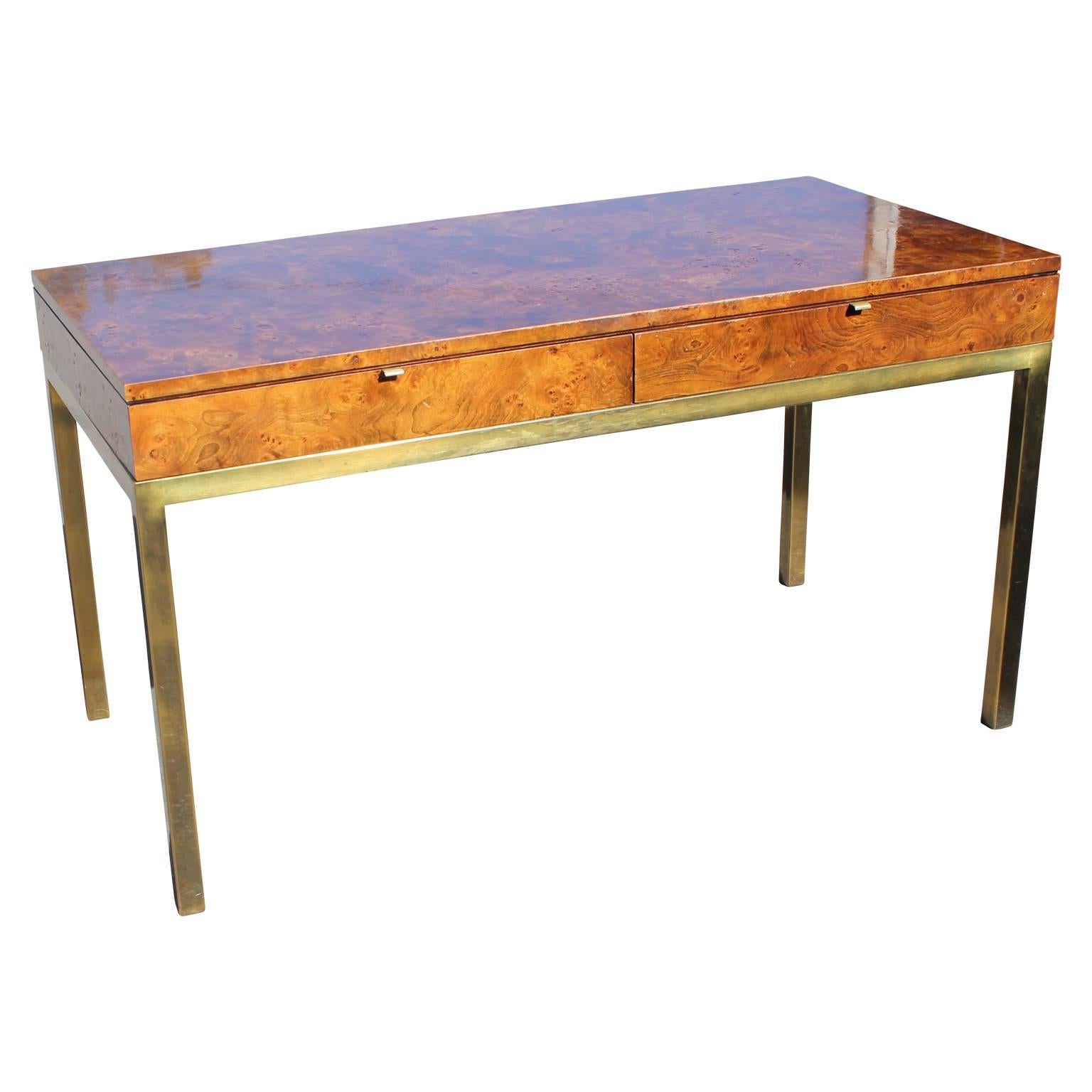 Beautiful burl olive wood desk or console table with brass legs and two drawers by Tomlinson.