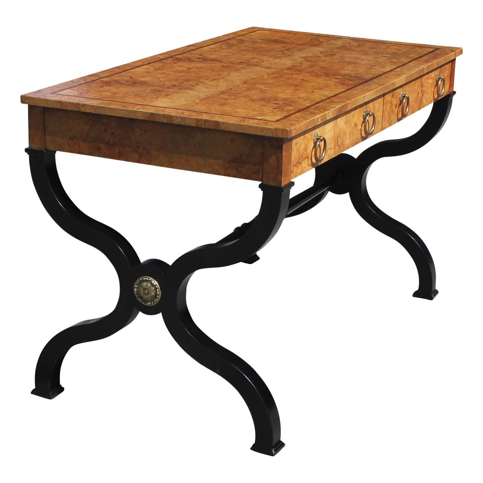 Gorgeous modern French burl wood desk with black Regency style legs, brass hardware and a rosewood or mahogany inlay.