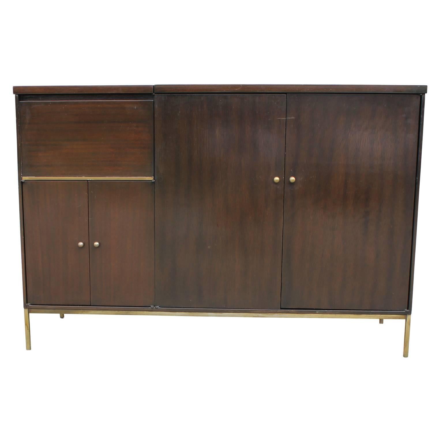 Unique Mid-Century Modern credenza / sideboard or Record Cabinet attributed to Paul McCobb's Connoisseur Line with multiple storage options. A door on top opens to reveal cabinet space, perfect for storing records or beverages. As well as a cabinet