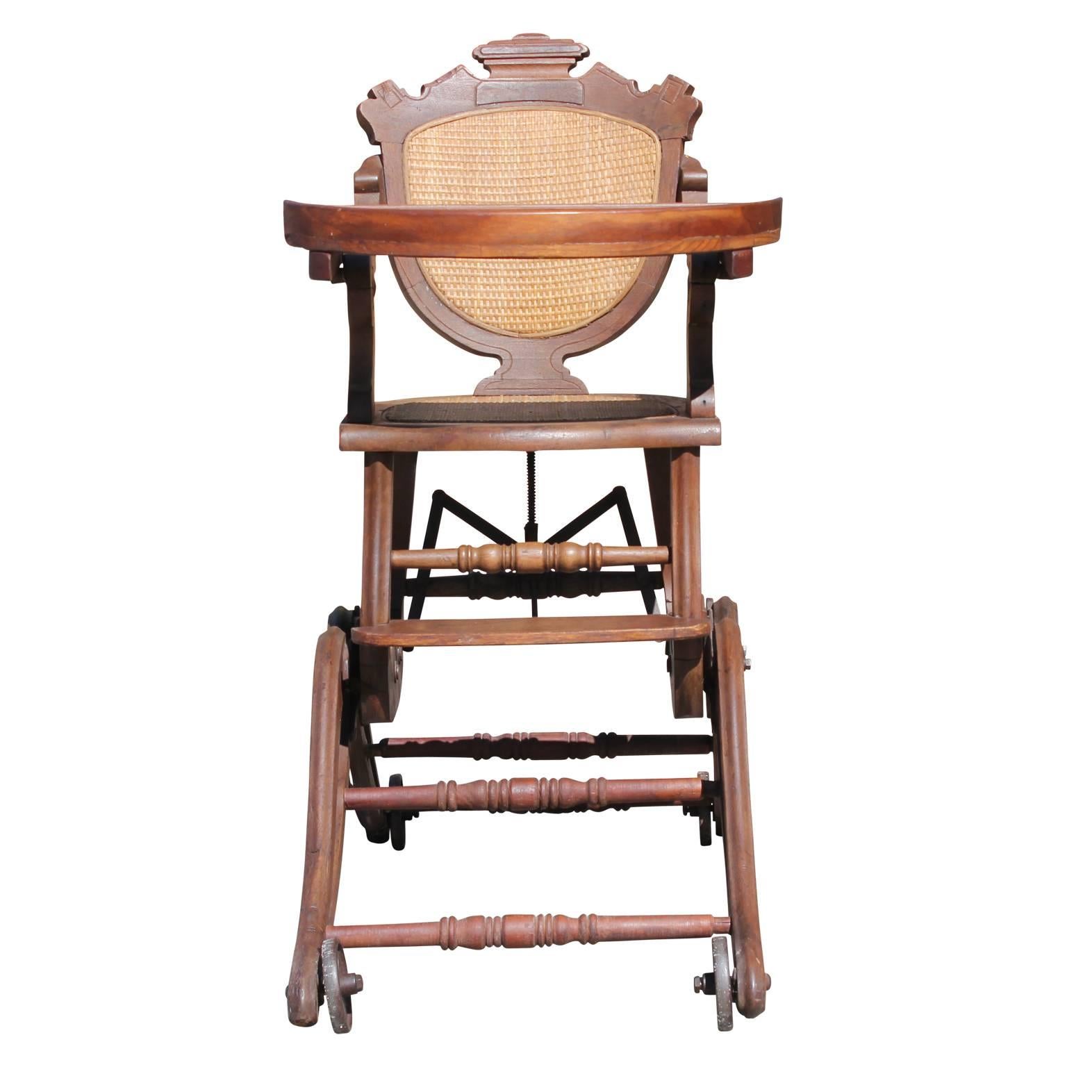 Gorgeous and unique walnut and cane metamorphic wheeled highchair, circa 1880s.