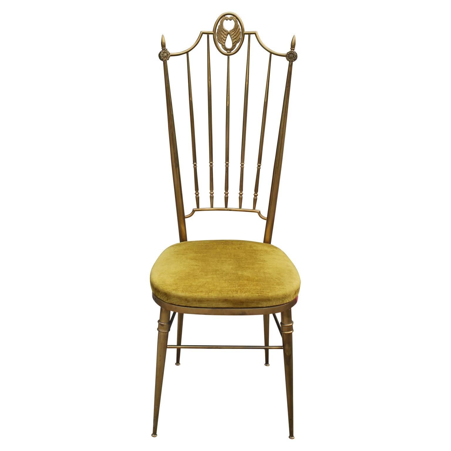Stunning pair of Hollywood Regency brass and yellow velvet highback chairs. The feature solid brass construction circa 1960. In excellent vintage condition ready to go. Wonderful feature chairs for luxe room.