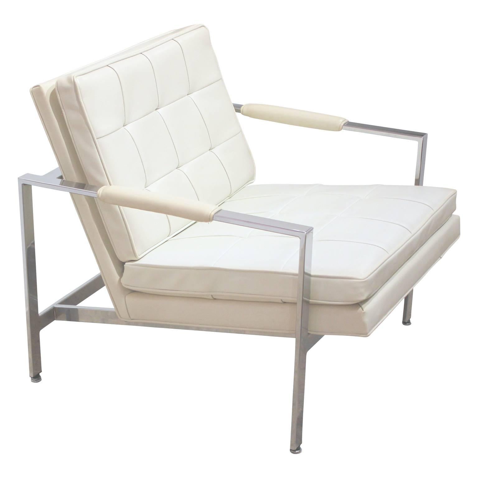 Gorgeous pair of white naugahyde and chrome lounge chairs by Milo Baughman. Perfect for any modern or mid-mod home. 