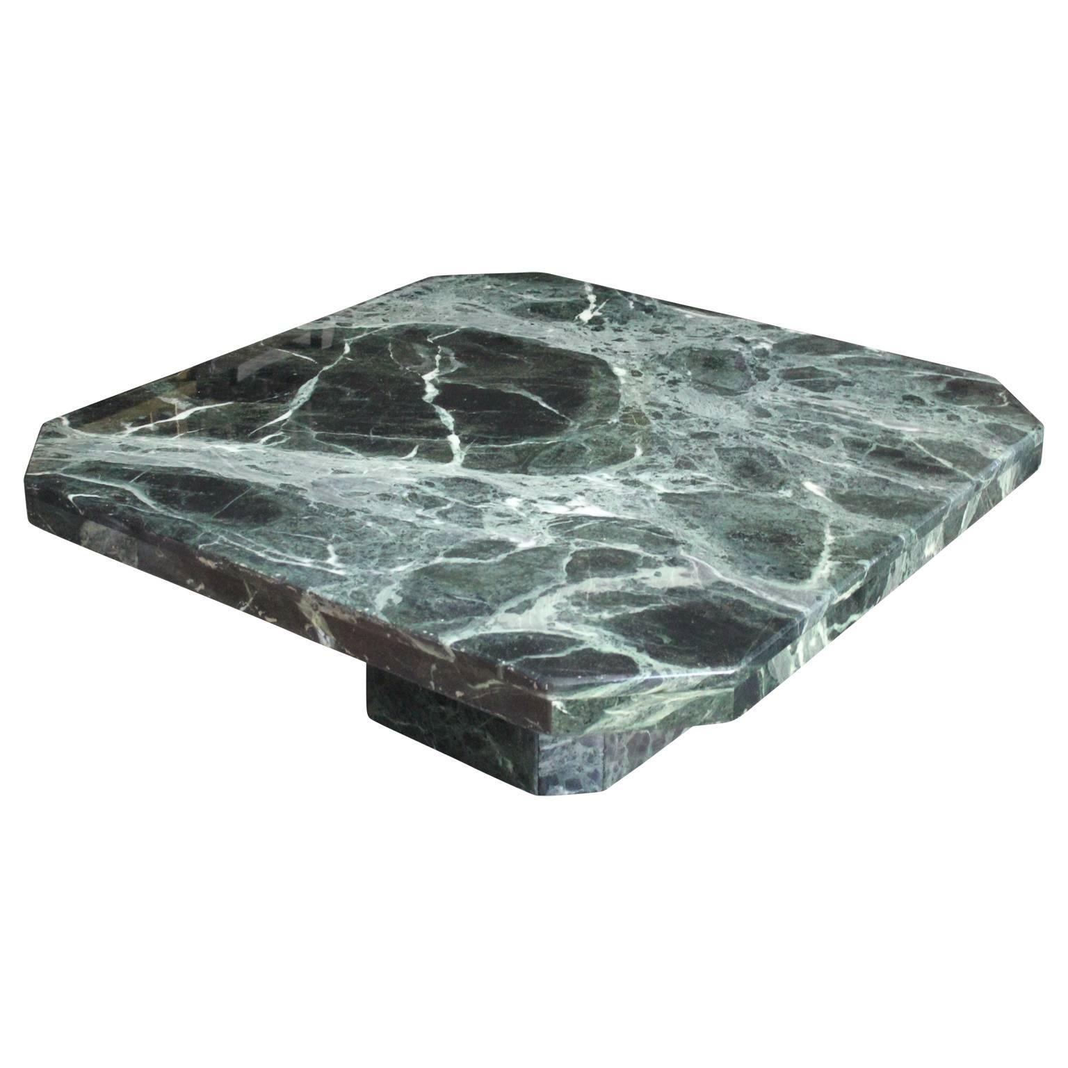 Stunning Italian pedestal coffee table made from the most gorgeous green marble. This piece is in two parts. The heavy marble top detaches from the pedestal base, making it easy to transport. Perfect addition to any modern or mid-mod space. Has a
