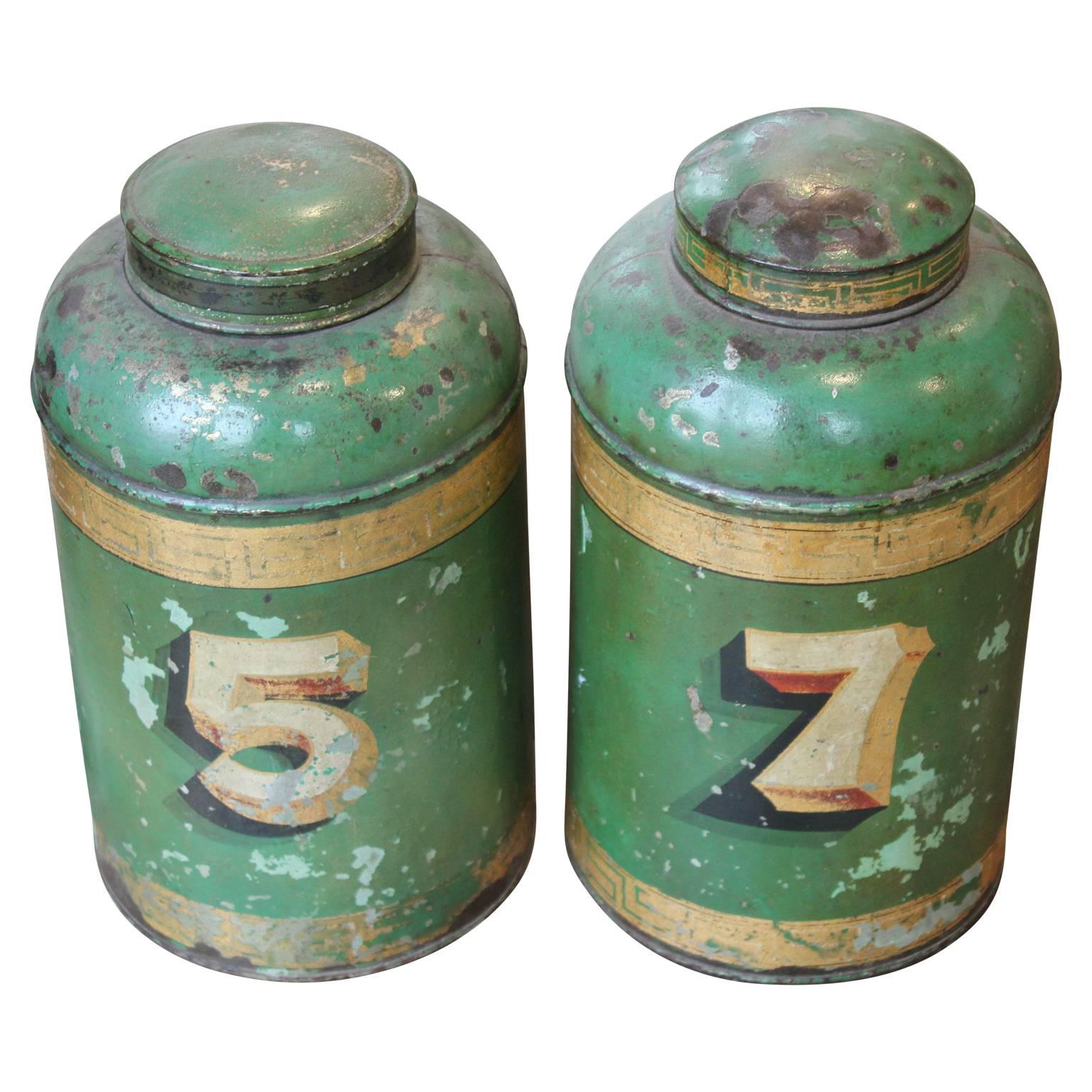 Wonderful distressed pair of English Green Tin Tole Tea Canisters. Perfect decorative objects to finish off the perfect room. 