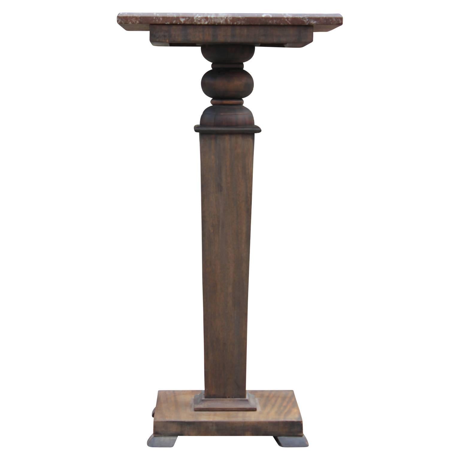 Gorgeous walnut pedestal with a marble top. 