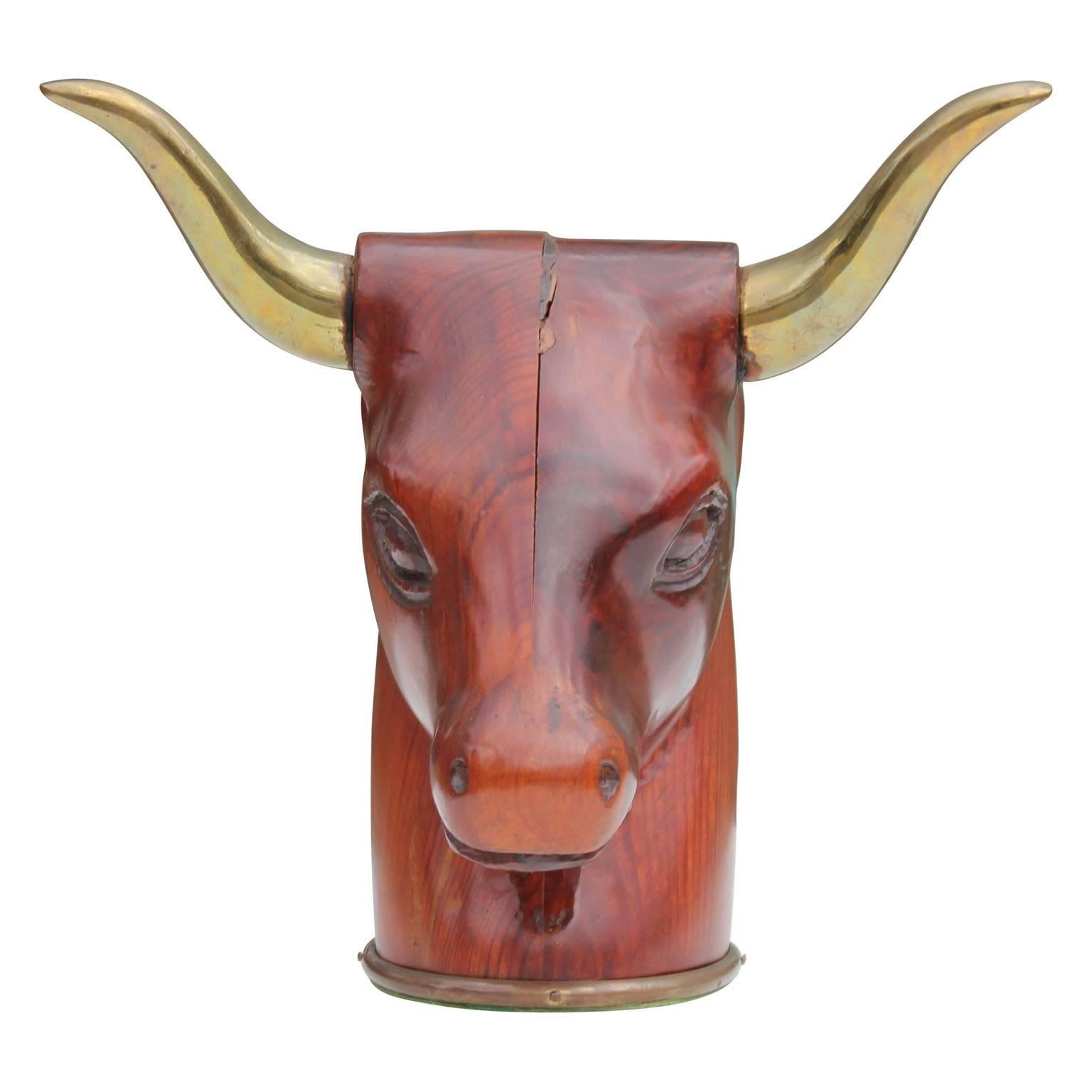 Unique wood and brass Sarreid bull head sculpture. Perfect statement piece to any room.