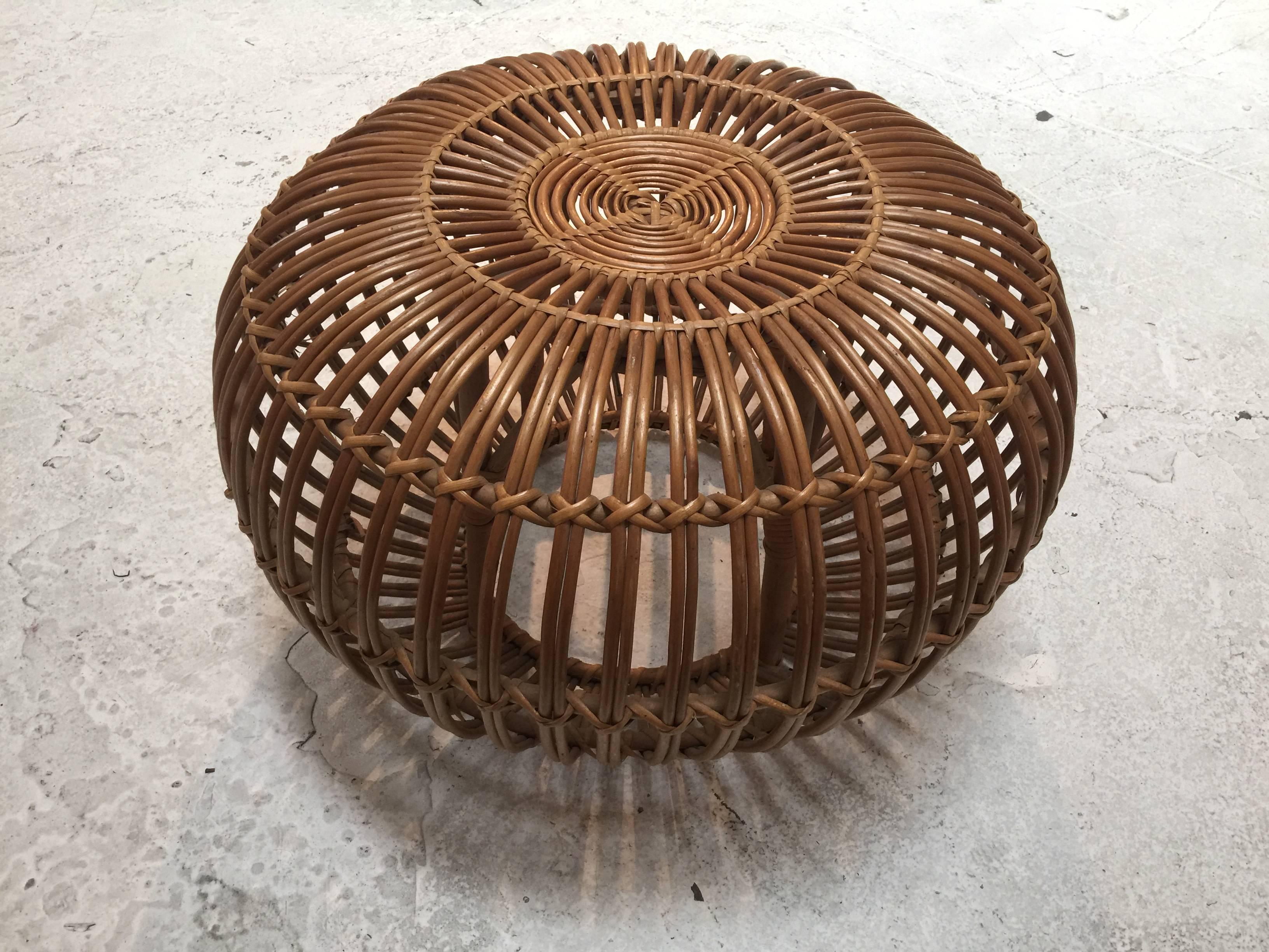 Beautiful round rattan pouf or ottoman designed by Franco Albini, manufactured by Vittorio Bonacina in Italy, circa 1950. This lovely piece is very well crafted of high quality rattan.

Measures: 24.0