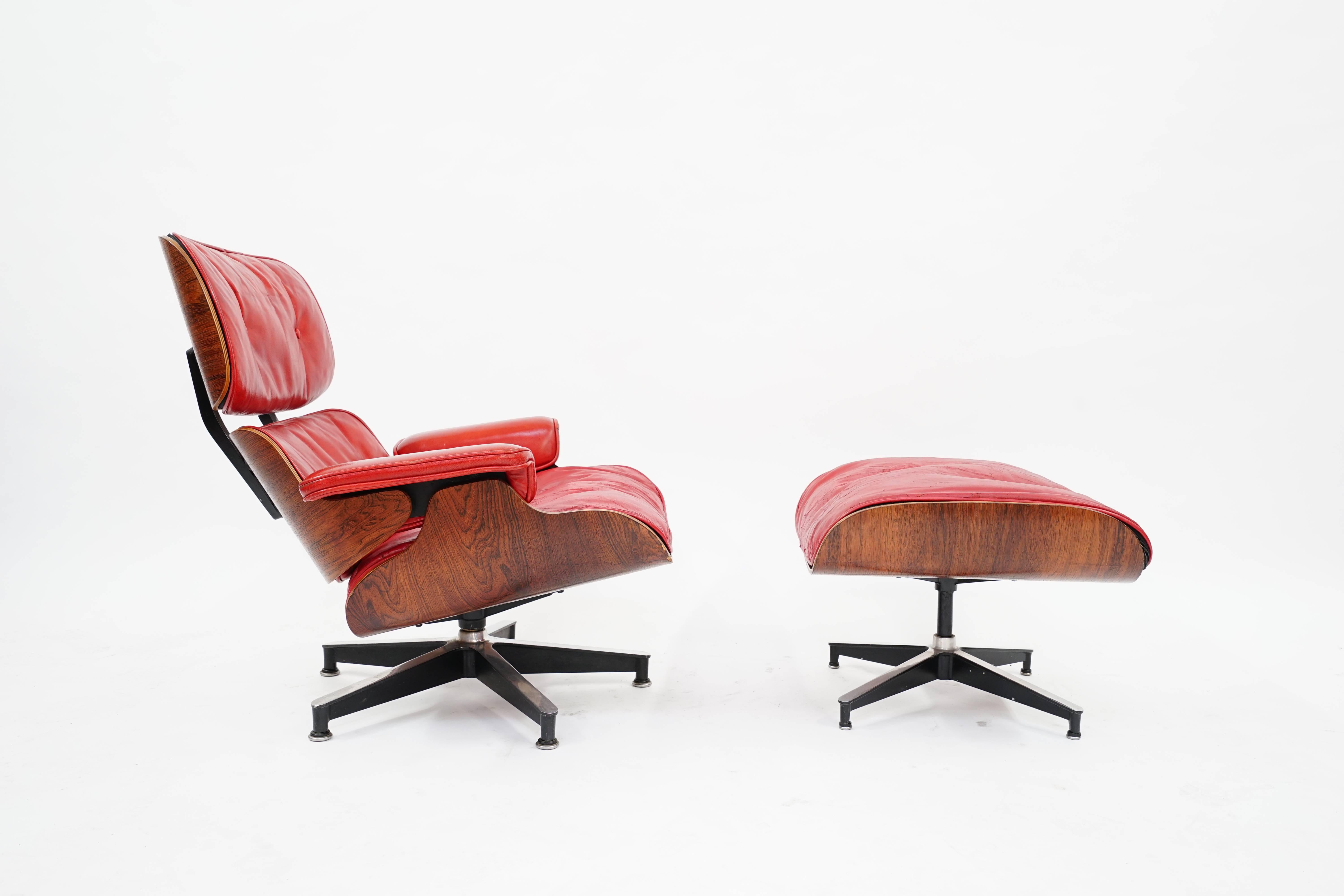 Extremely Rare 1st Series Eames 670 Lounge Chair and 671 Ottoman, Custom made for Charles W Freeman lll  Sr VP of Pepsi Co by Herman Miller, Circa 1960 Only 2 chairs were ever made.  Amazing Brazilian Rosewood Grain pops against the Pepsi Red