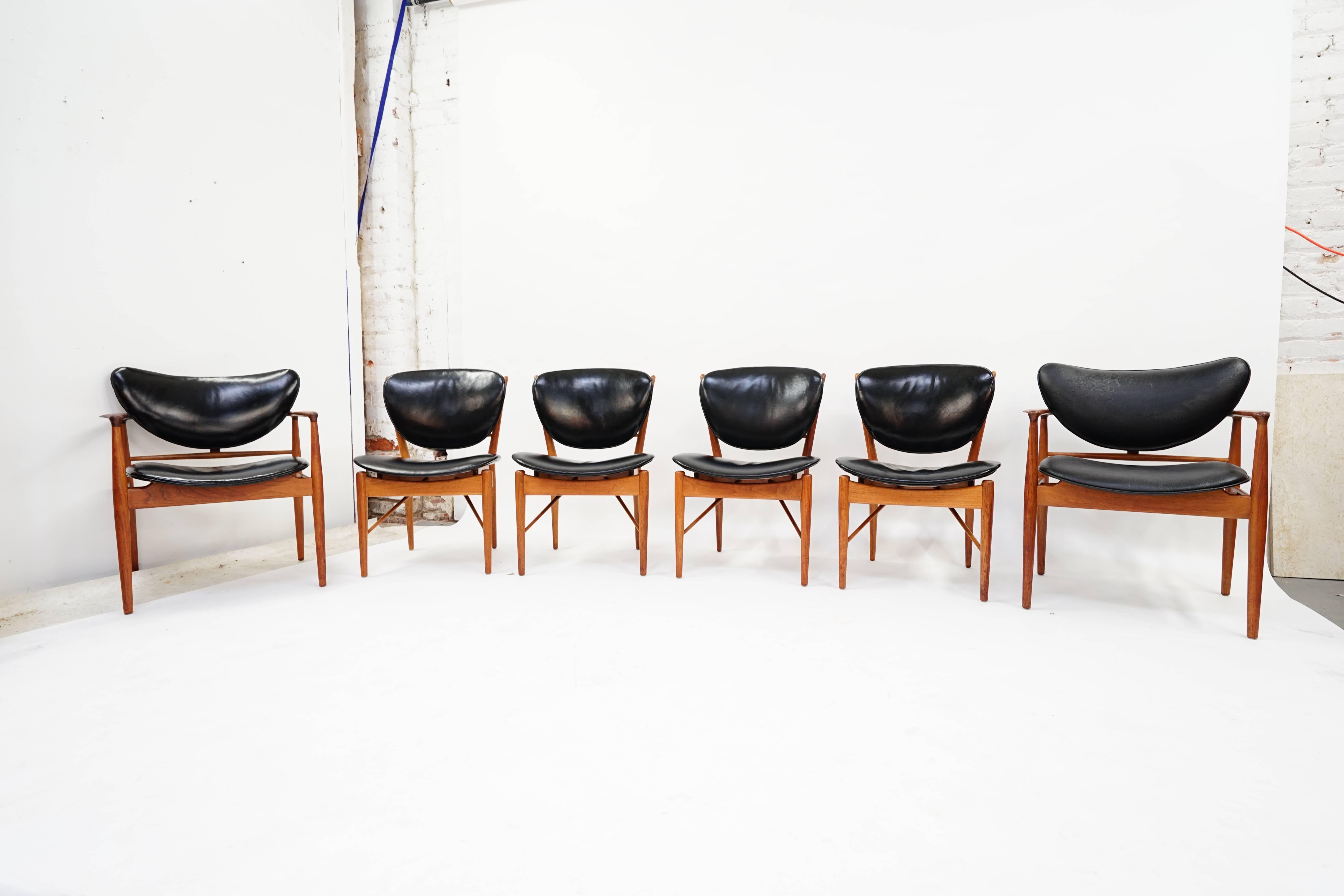 Absolutely Stunning set of 6 Early Finn Juhl Walnut Dining Chairs with the Original Thick Black Ox Hide Leather Upholstery, 2 NV-48 Armchairs and 4 NV-51 Side chairs, Circa 1951