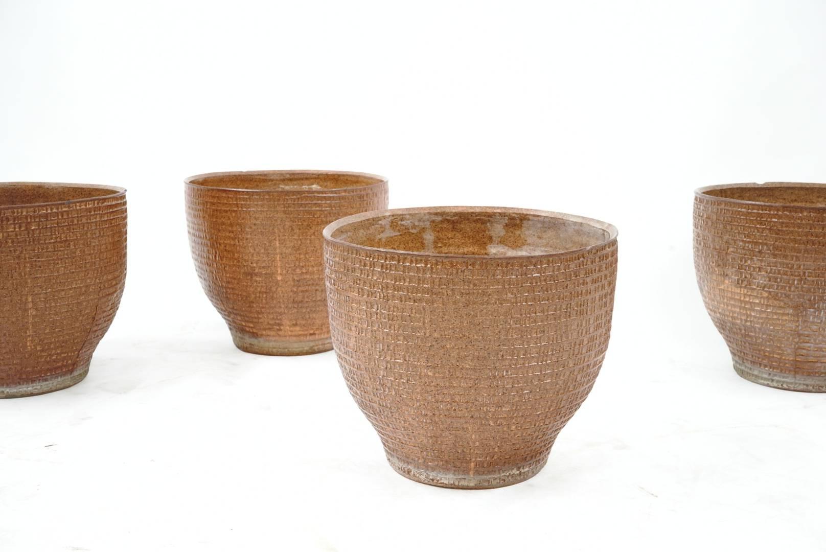 Rare set of four matching Pro Artisan vessels designed by David Cressey for Architectural Pottery, amazing patina and texture on this set and perfect for Indoors or Garden Setting. 

Note; I will sell in Pairs.