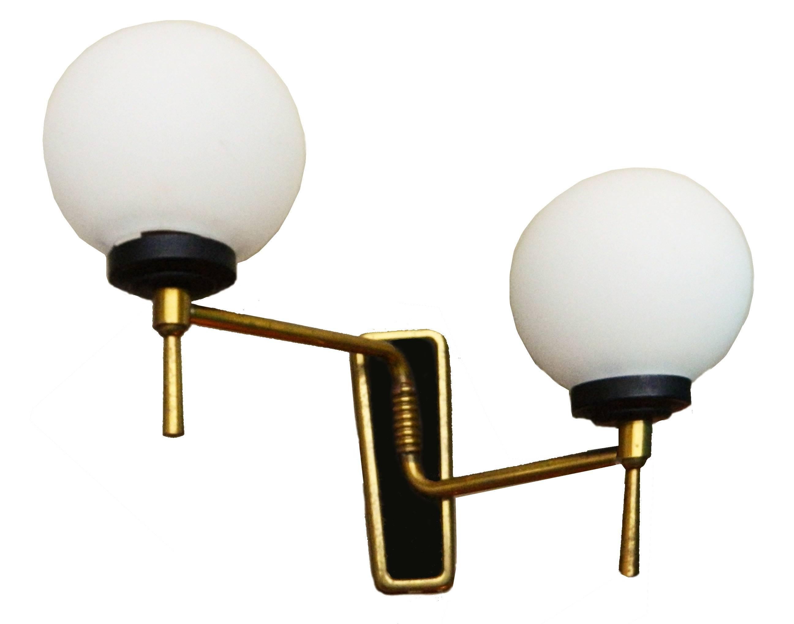 A pair of 1960s Maison Lunel pair of sconces, two lights per sconce.
US rewired and in working condition.
45 watts max per bulb.
Custom backplates available, ask for a quote.
Have a look on our impressive collection of French and Italian Mid