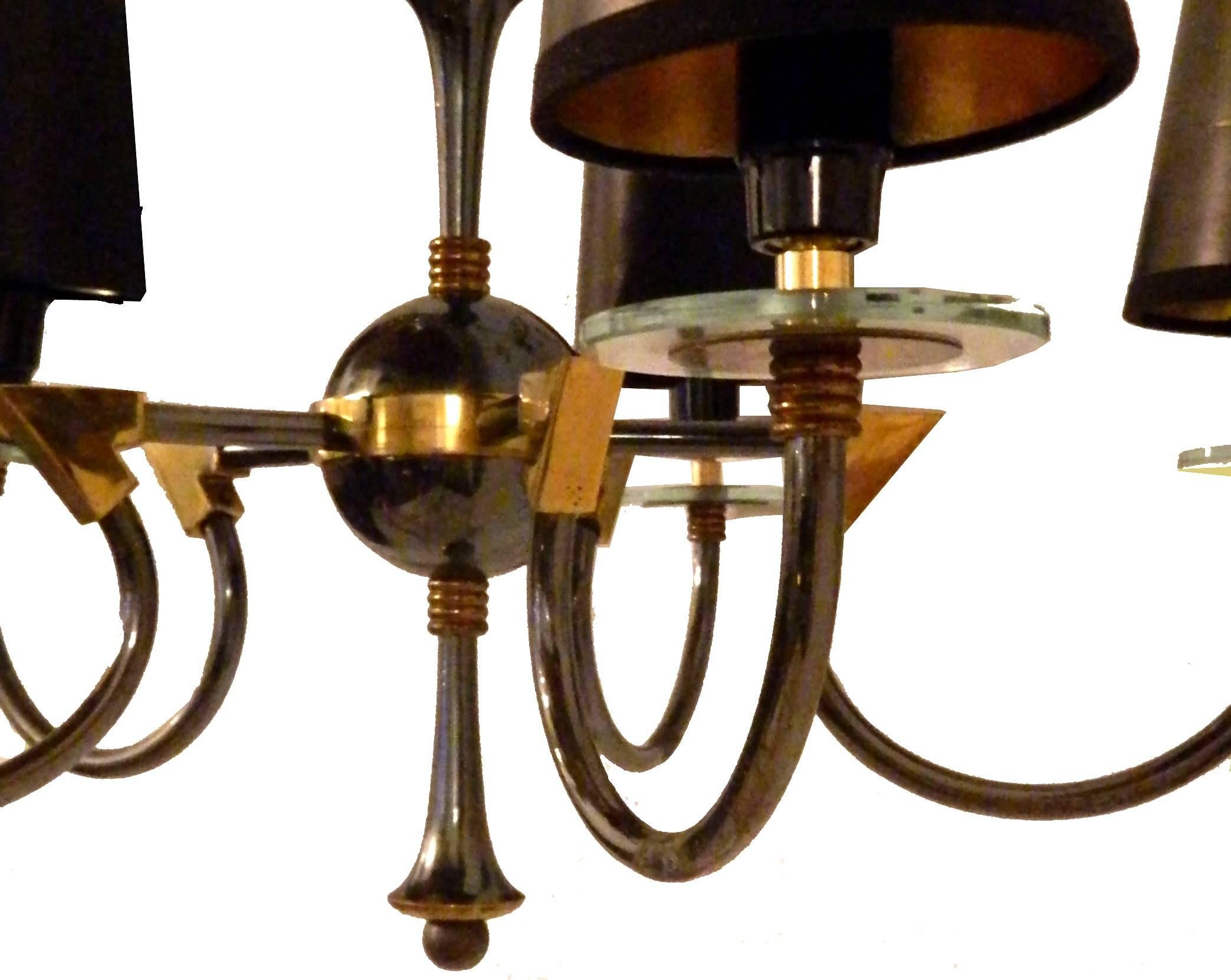 Superb Maison Jansen two-tone brass and gun metal five-light chandelier.
US rewired and in working condition.
5 bulb, 60 watts max each.
Pair available. Priced for one.
 
