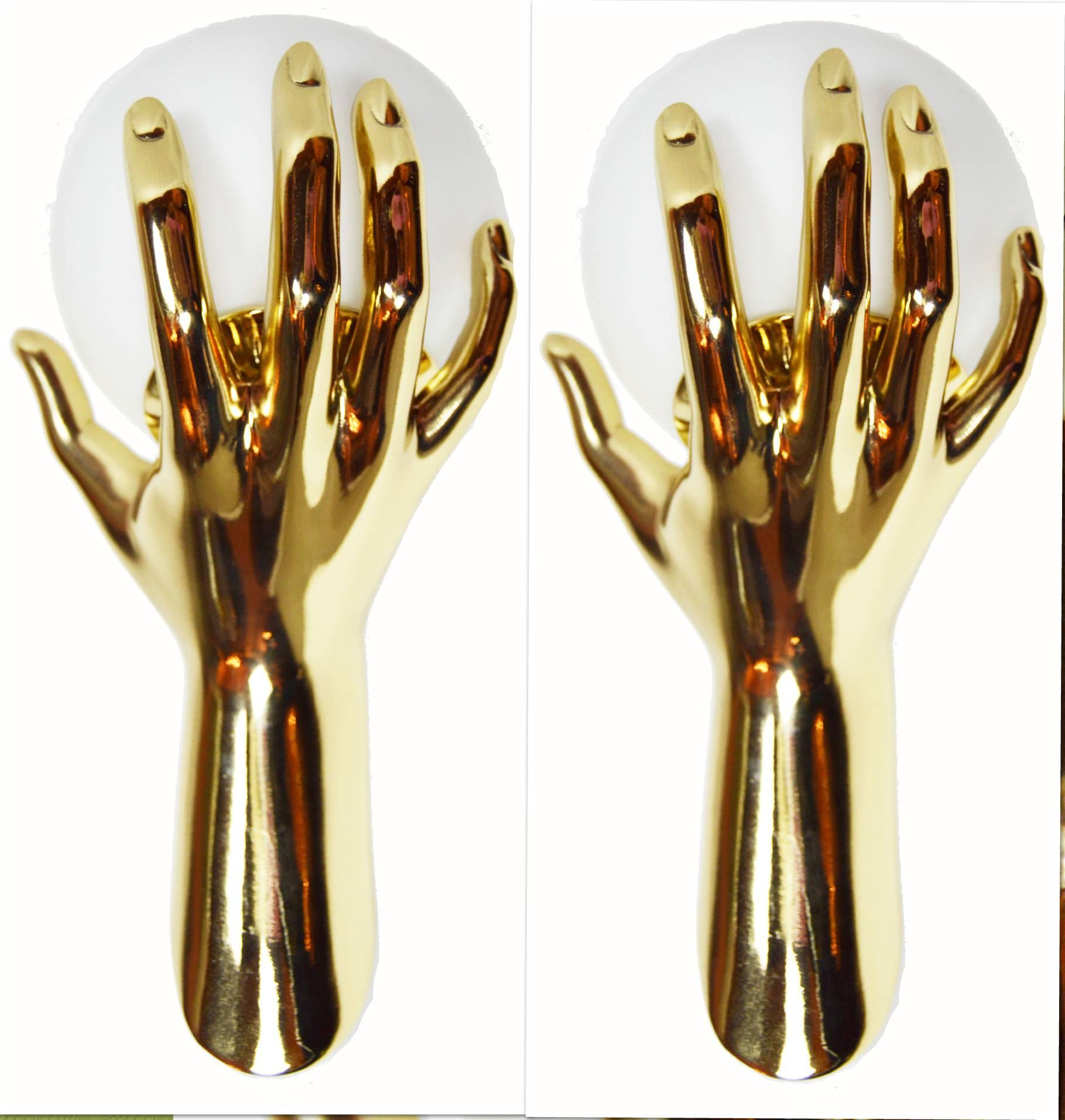 Fantastic  Pair of Sconces by Maison Arlus, figuring a gold hand holding an opaline glass globe
Provenance : Parisian hotel ( Rive Gauche )
US wired and in working condition.
Have a look on our impressive collection of French and Italian Mid Century
