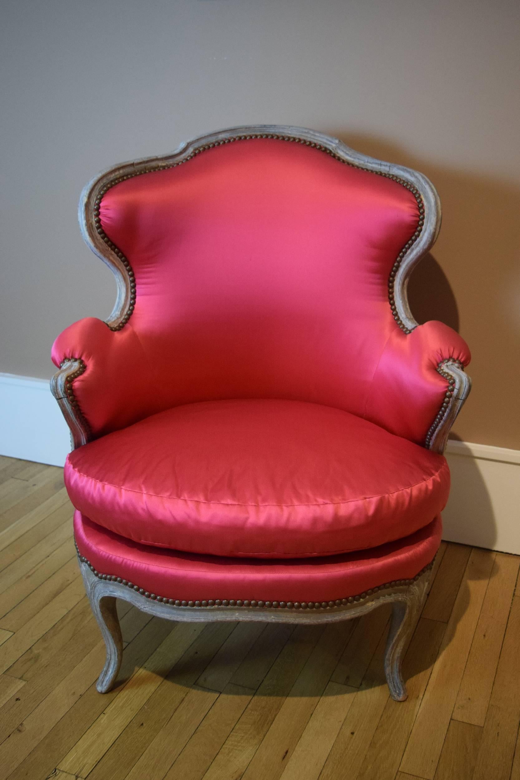 This fine 18th century armchair belonged to Elsa Schiaparelli, the fashion designer who was celebrated for her surrealist creations, and patronage of Salvador Dali and Jean Cocteau. The new silk-satin upholstery is in her signature color Shocking