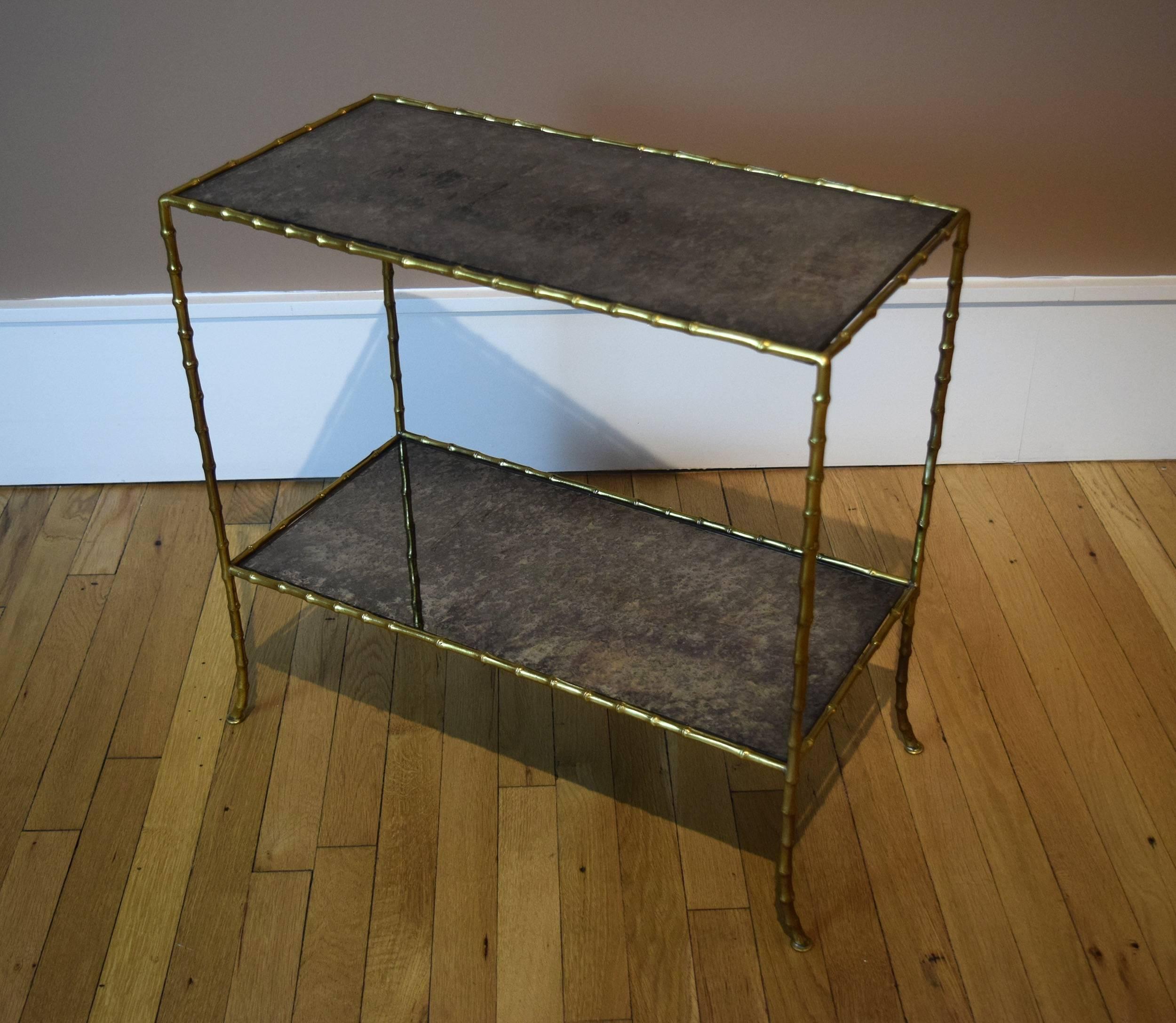This gilt bronze side table by Baguès has its original, antiqued-mirror plates. It was made by the celebrated Paris bronzier, circa 1950.