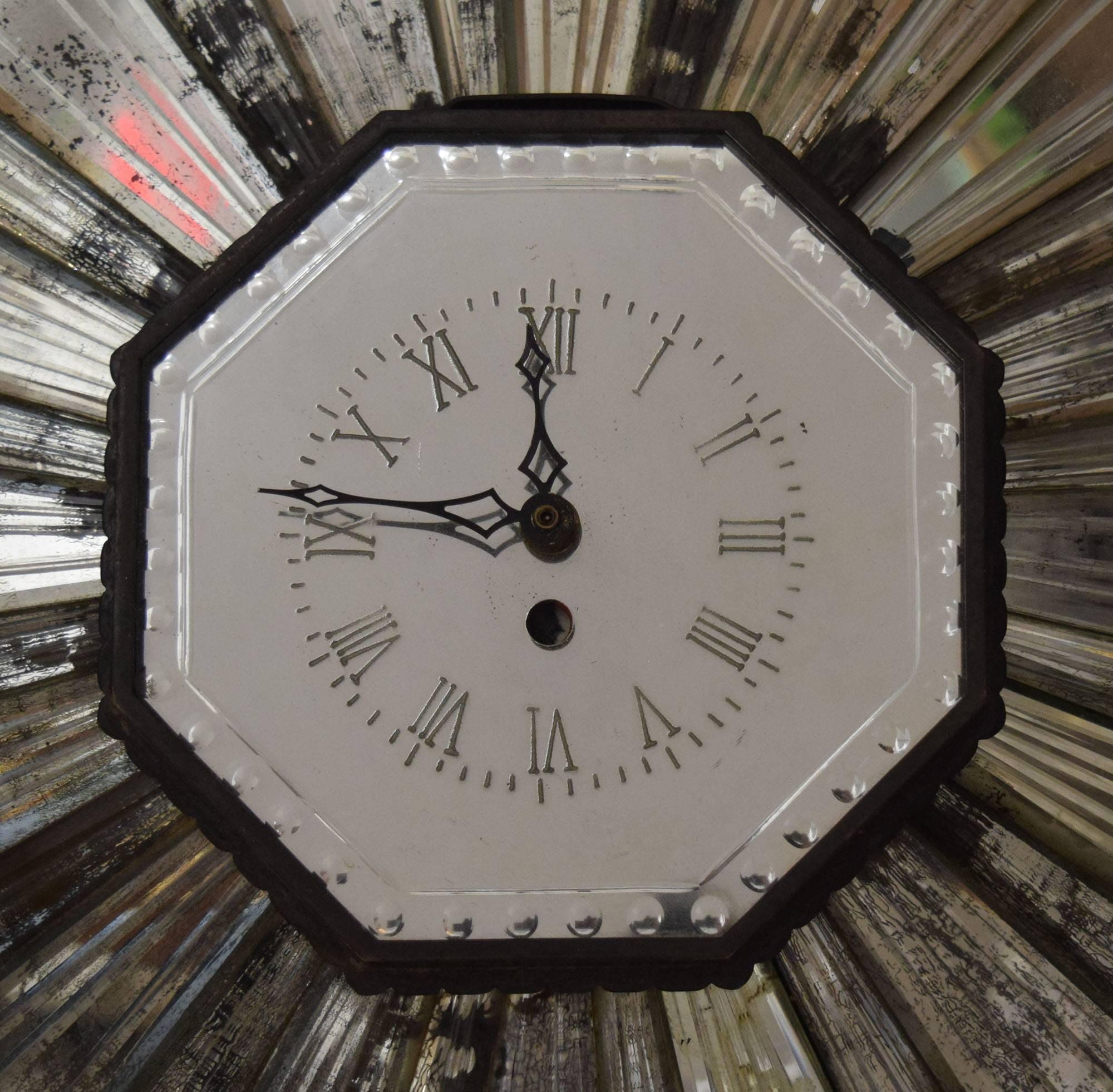 This stylish 1930s sunburst mirrored clock with a mirrored dial was in the Chicago townhouse of Mr. and Mrs. Watson Blair, and subsequently their Palm Beach house. It was probably purchased for the Blairs by David Adler who decorated the townhouse,