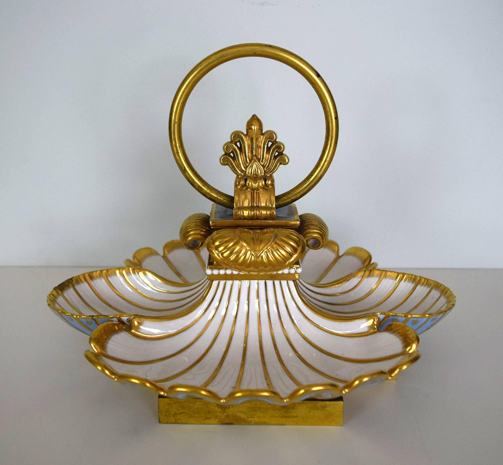 This spectacular sweetmeat or candy dish comes from the Sevrès dinner service made in 1832 for King Louis-Philippe's chateaux of Compiègne and Saint-Cloud. The service was supplied to these royal households from 1832 to 1847, but the "32"