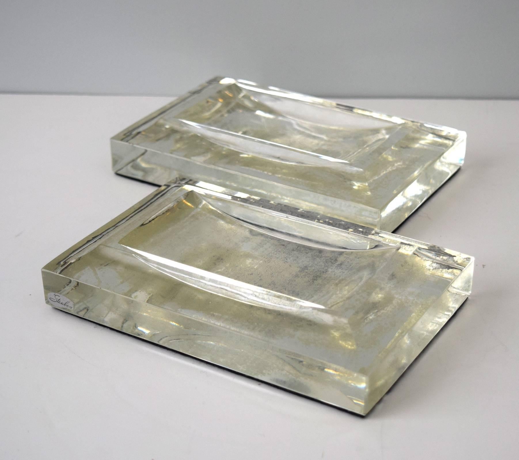 This pair of Steuben glass ashtrays were silvered on the bottom, and backed with black felt to prevent scratching. One ashtray bears the firm’s adhesive label. They come from the mirrored ballroom of the historic Livingston-Griggs house on Summit
