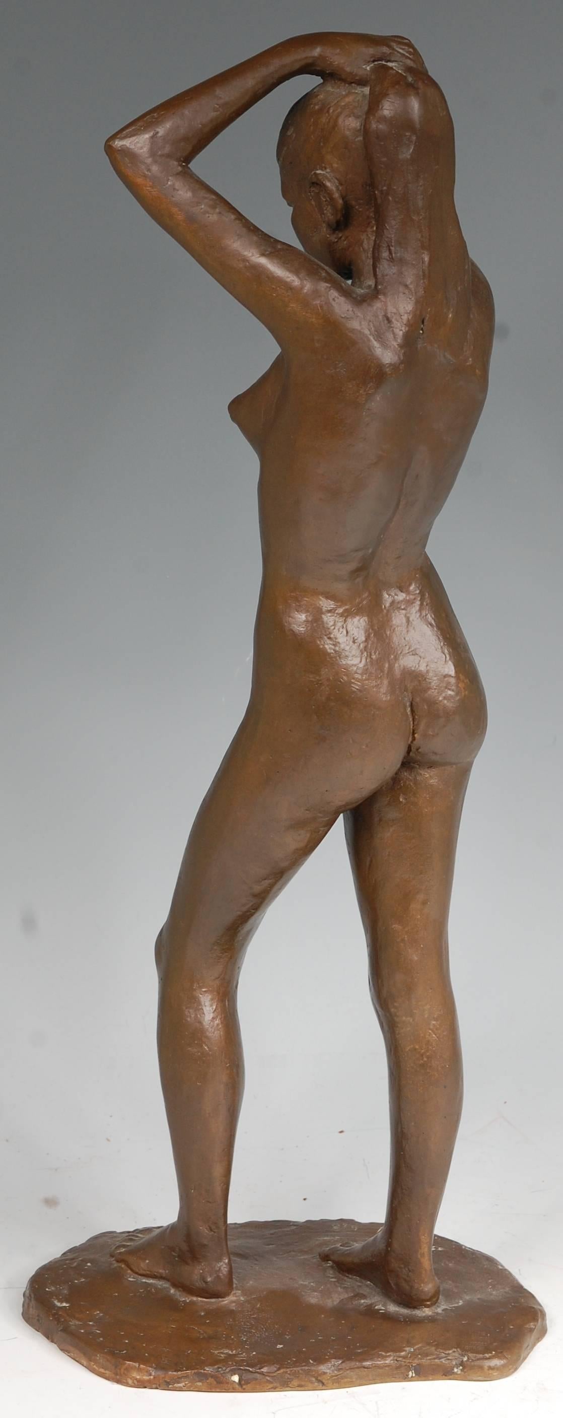 A Mid-Century bronze figure of a standing female nude by Anker Hoffmann (Danish, 1904-1985). This large tasteful bronze is monogrammed "AH' and numbered '5/50' in the cast. It is highly decorative piece in a mid-brown patina.