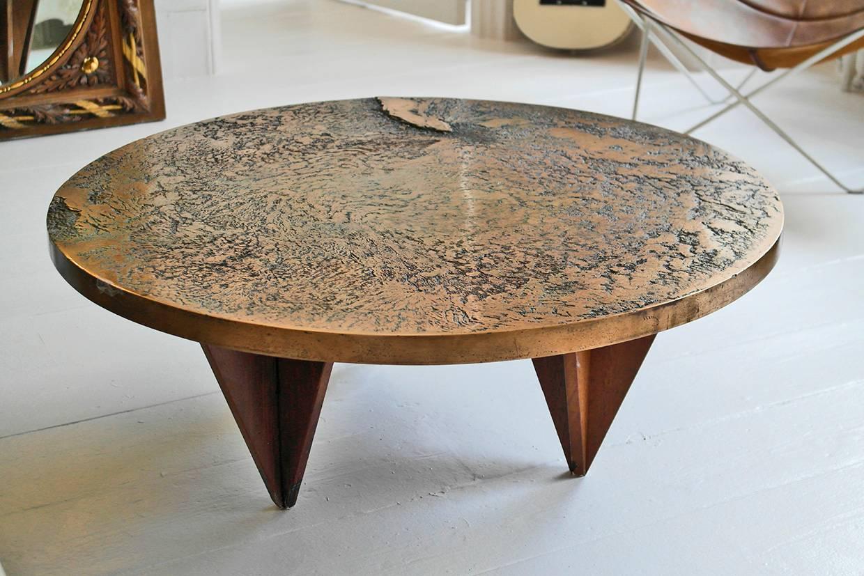 An exemplary cast bronze cocktail table with lunarscape detailing, highly decorative with beautiful rich patina. Signed S S ’95 - possibly Silas Seandel.