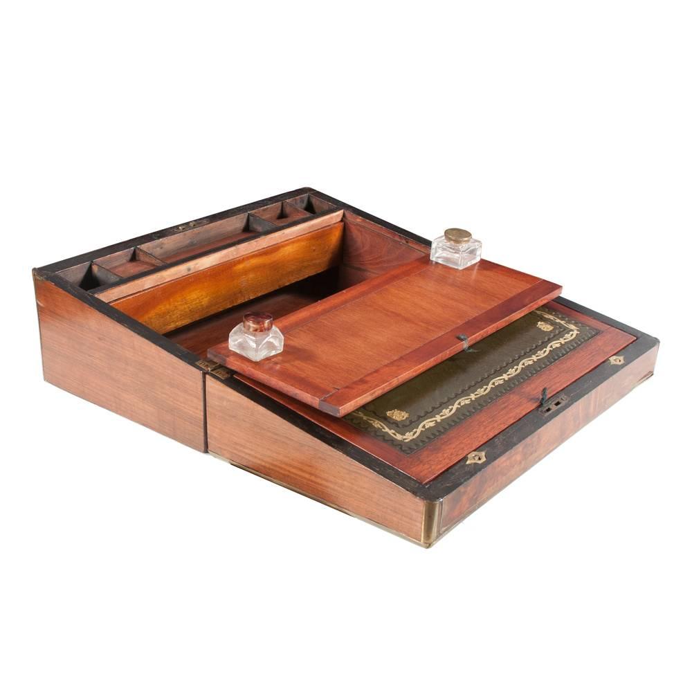 Sheraton brass bound walnut lap desk with good fitted interior, circa 1880. Desk features original gold tooled leather top, as well as antique brass trim.
 