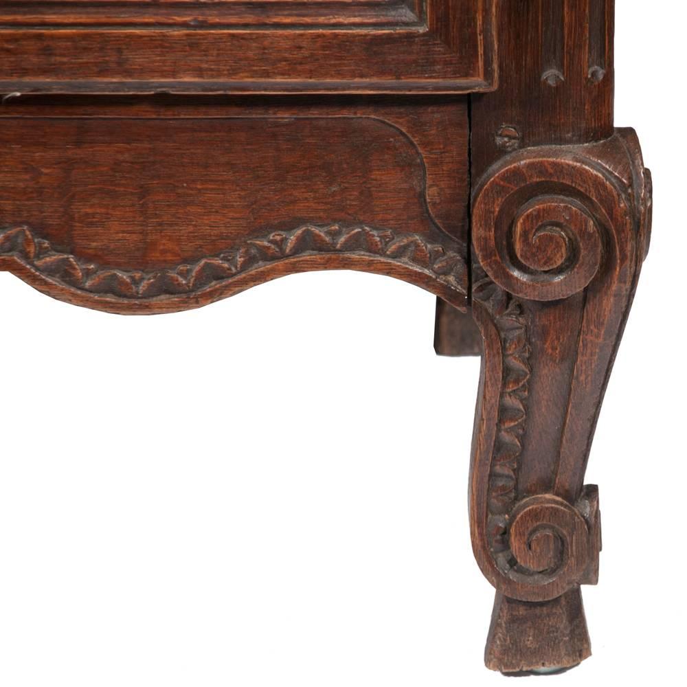 Classic Country French two-part buffet de corps with an arched and carved pediment, featuring grill work doors. The base has two arched panel doors and a shaped apron, circa 1860.