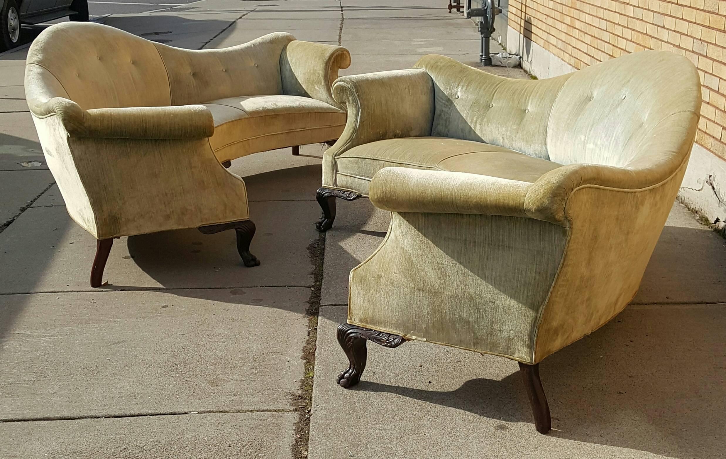 Matched pair of oversized, very dramatic Queen Anne curved sofa's, featuring exaggerated hump back, Rolled arms, semicircle curve and carved mahogany paw foot, Modernist meets traditional,, Stunning!