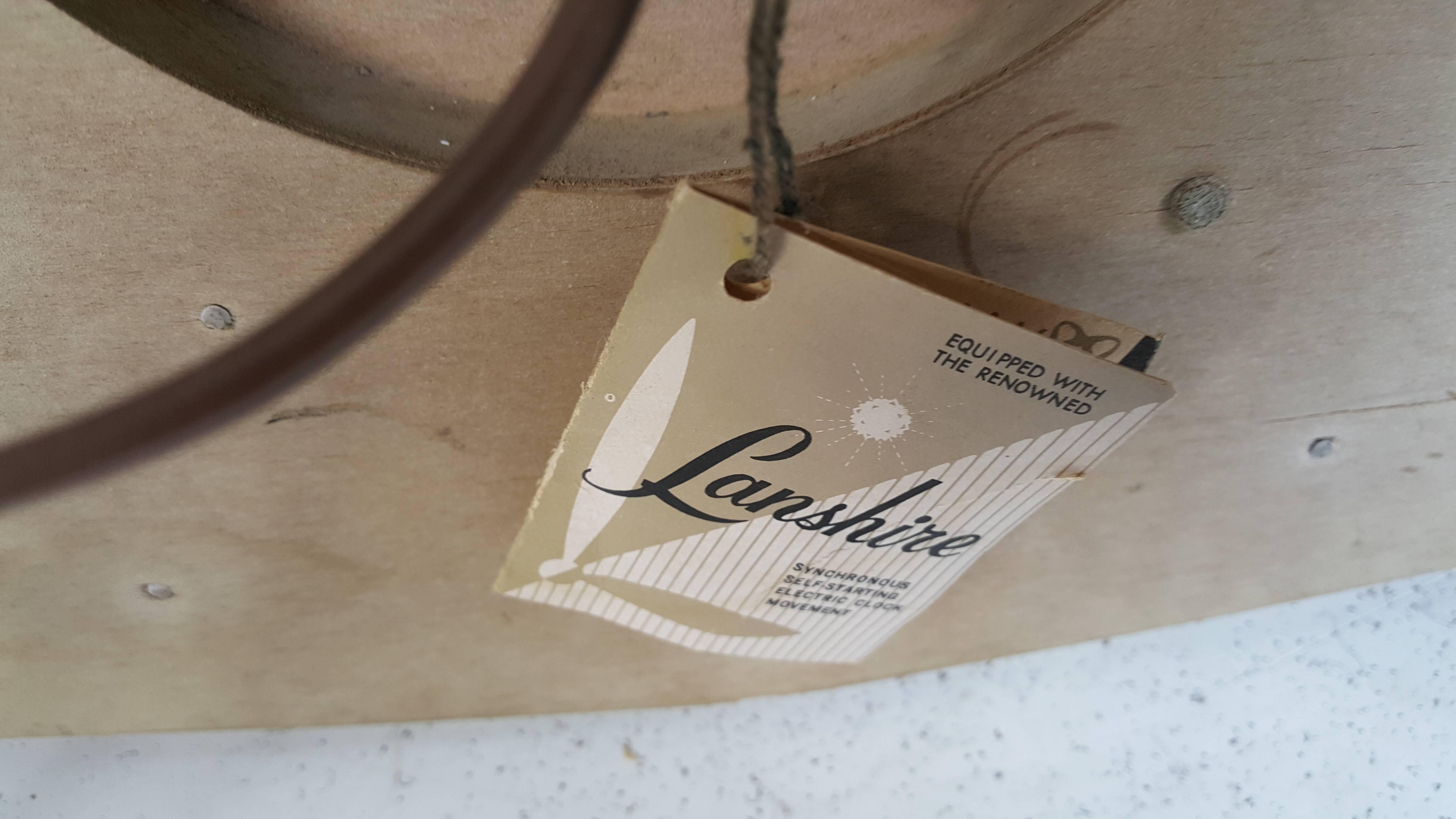 Modernist Cursed Oak Wall Clock by Lanshire In Good Condition In Buffalo, NY