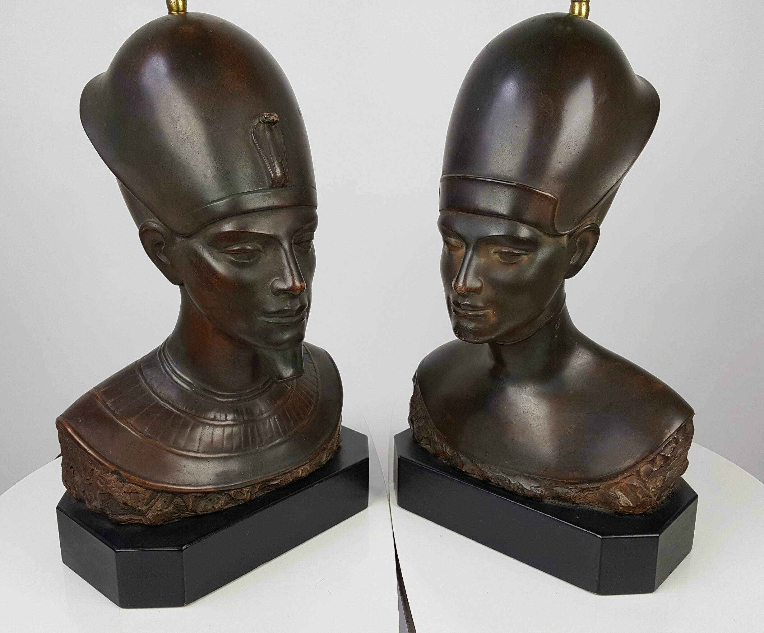 Stunning pair of bronze clad table lamps depicting Egyptian Pharoh (King) and Queen, Nefertiti? Amazing detailed chiseled features, jewels and head piece's, wonderful bronze patina, wooden plints, signed Haruil.