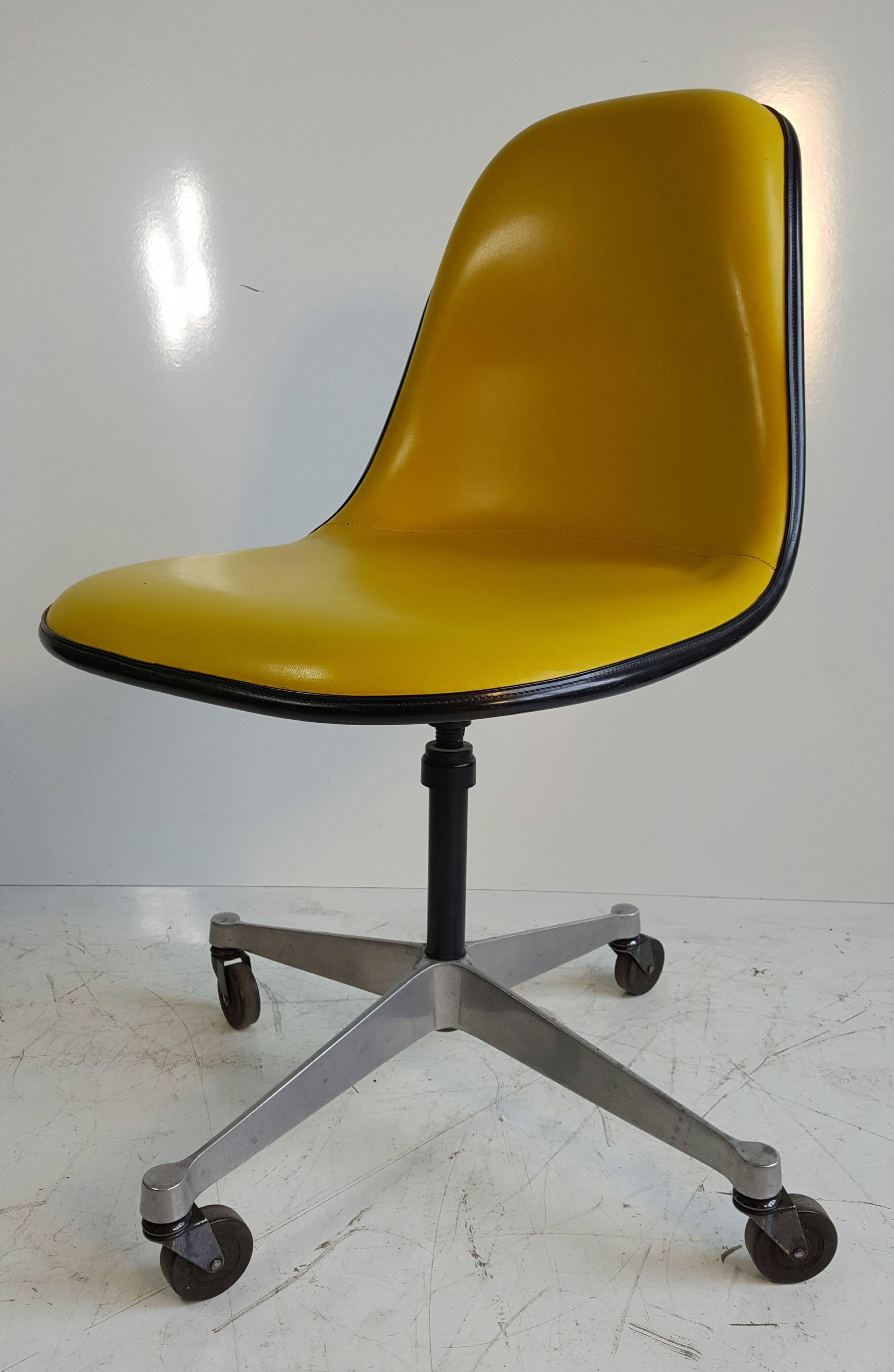 Rare PSCC desk chair designed by Charles & Ray Eames for Herman Miller Secretary Chair with original mustard yellow Naugahyde. Chair fully swivels. This chair was produced for a short time. Retains original Herman Miller label.