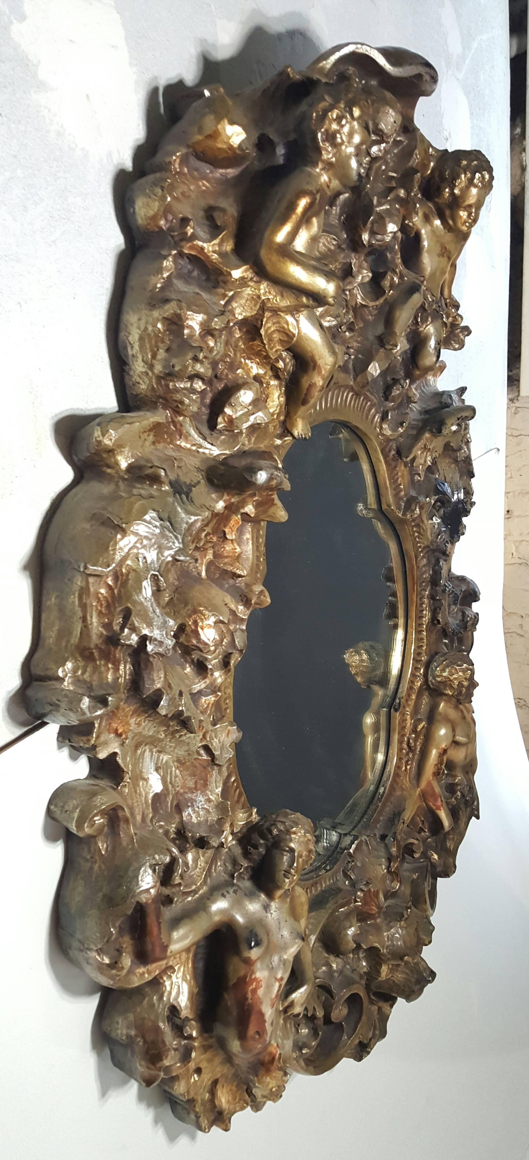 Large sculptural fiberglass and resin fantasy wall mirror made by Finesse Originals featuring angels, centaur and dog motif. Large-scale, minor damage to angel ear.