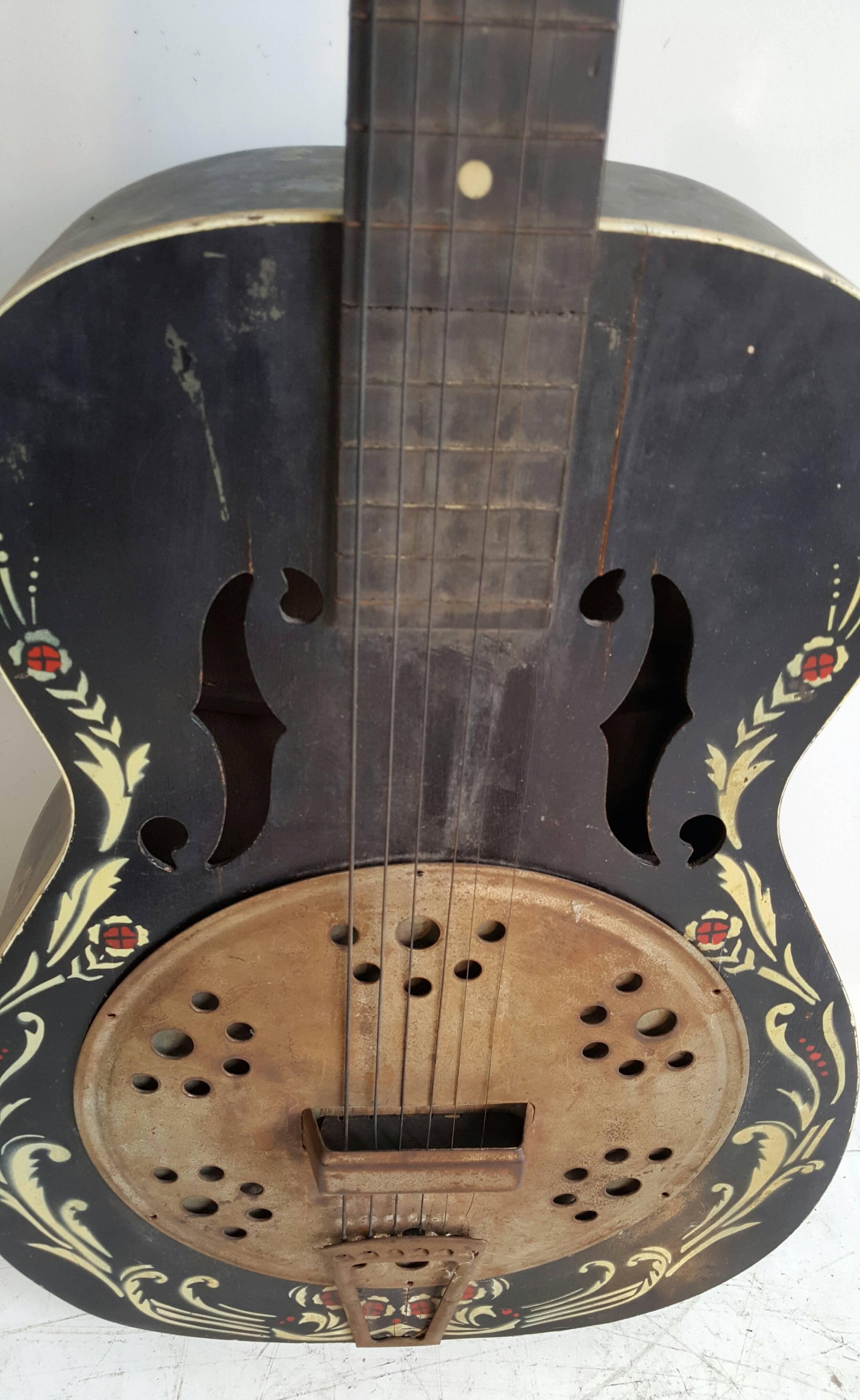 Nice antique Del Oro Faux Resonator guitar. Charming stencilled graphic design,, All original, head stock tuners, bridge and resonator. Piece of art sculpture although I’m sure guitar can be restored and would sound amazing. Kay Del Oro Pre-WWII