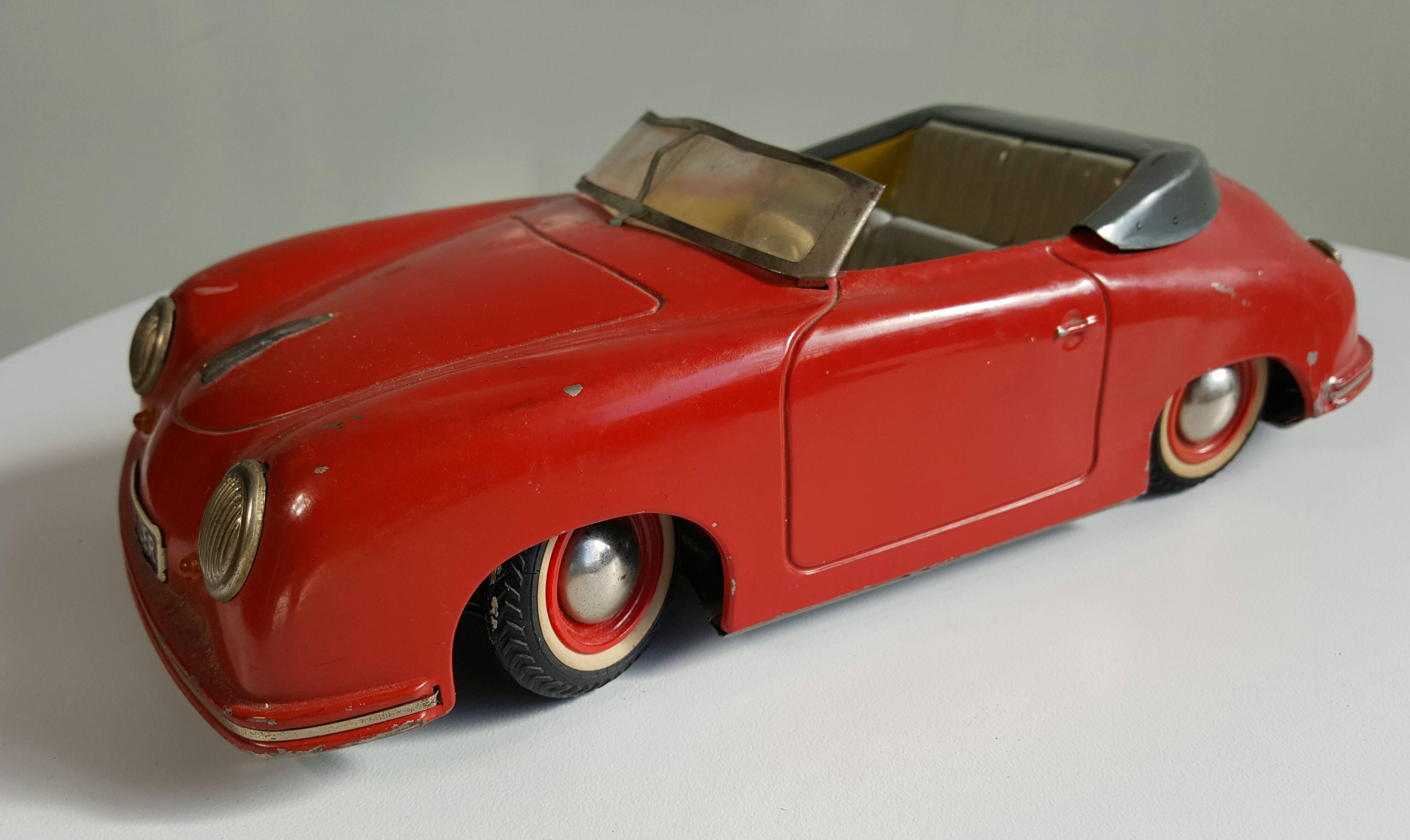 1950s Distler Porsche 356 electromatic 7500 Germany friction toy. Nice early model made in the 1950s, Germany. Features working steering wheel,, stick shift.