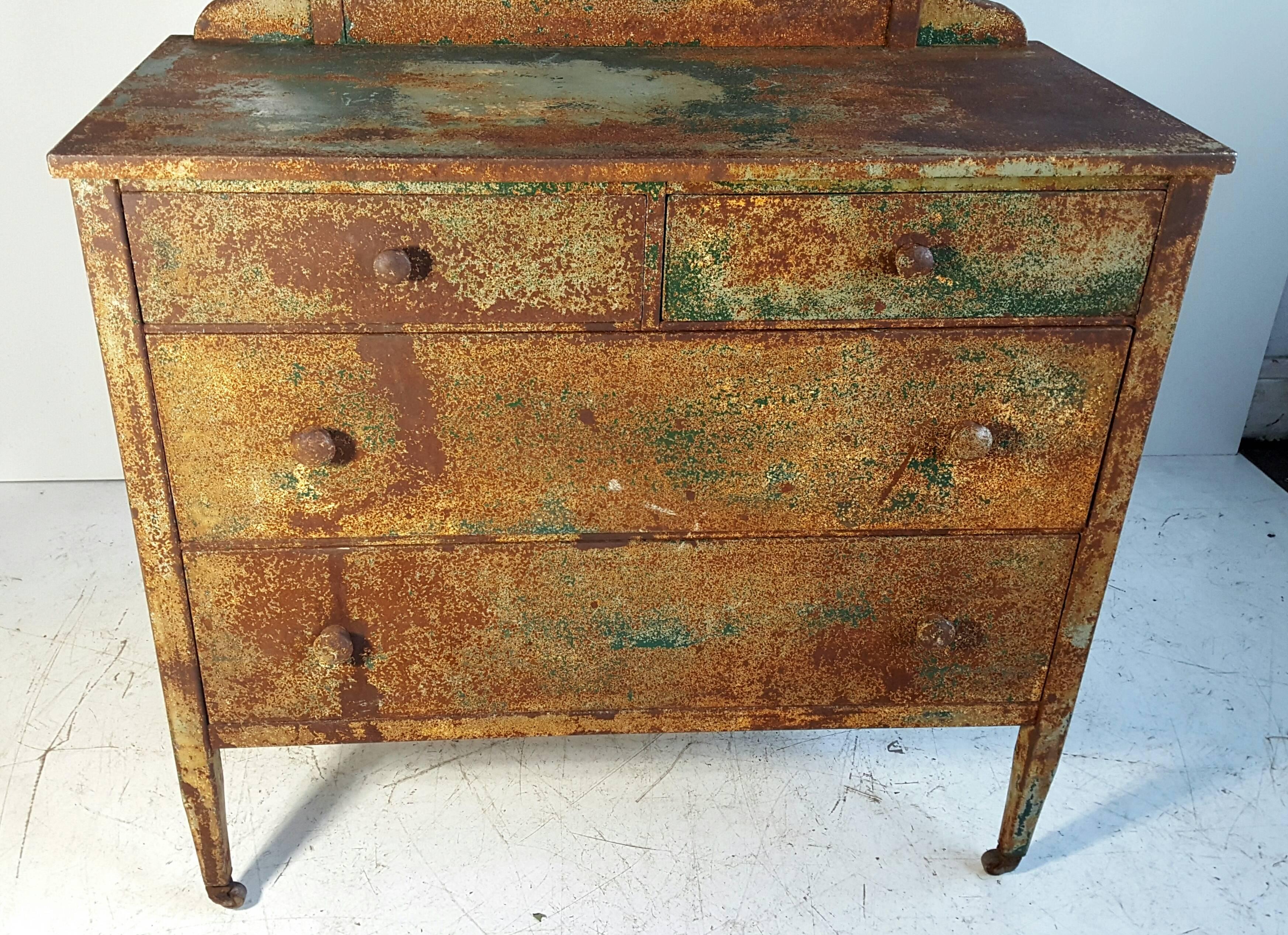 1930s Industrial steel four-drawer chest or vanity. With two generous size main drawers, two upper drawers. Retains original tilt mirror, wonderful patina, surface, mirror measures: 23